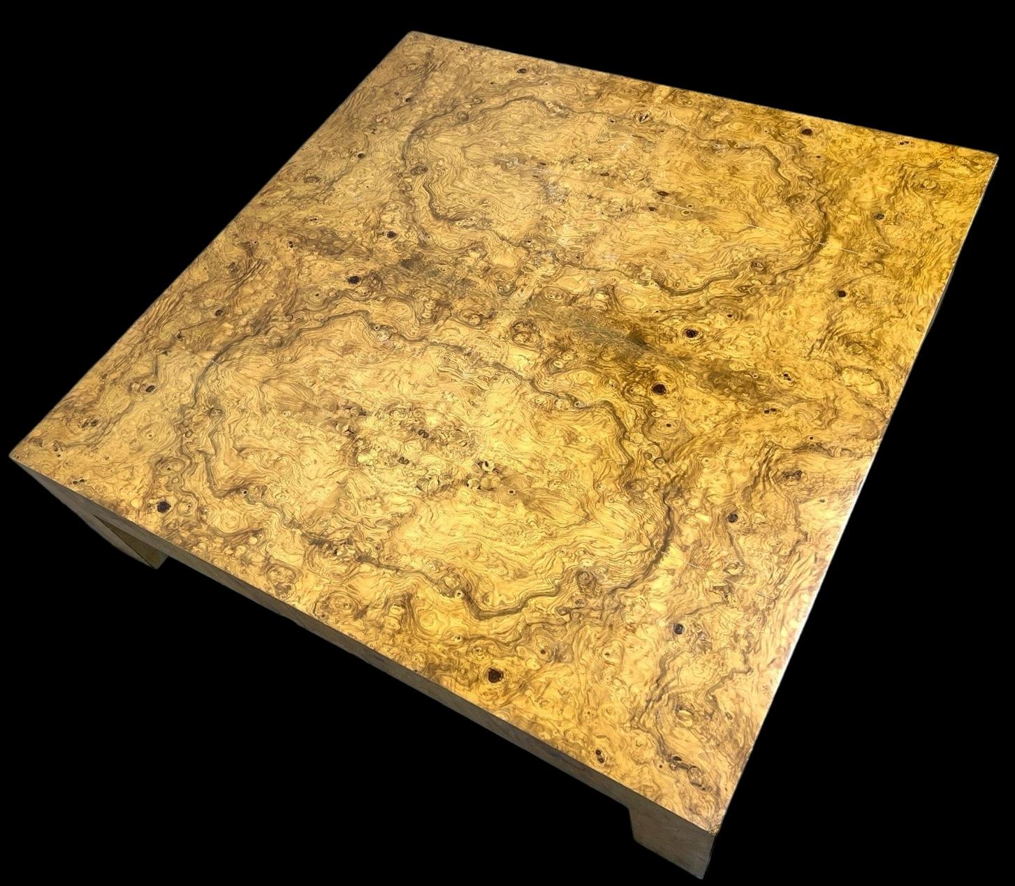 This is a 1970s large scale organic modern olive burl wood coffee table attributed to Milo Baughman. The wood is a beautiful olive burl wood veneer. Milo had a fifty year association with Thayer Coggin, which produced some of his most iconic