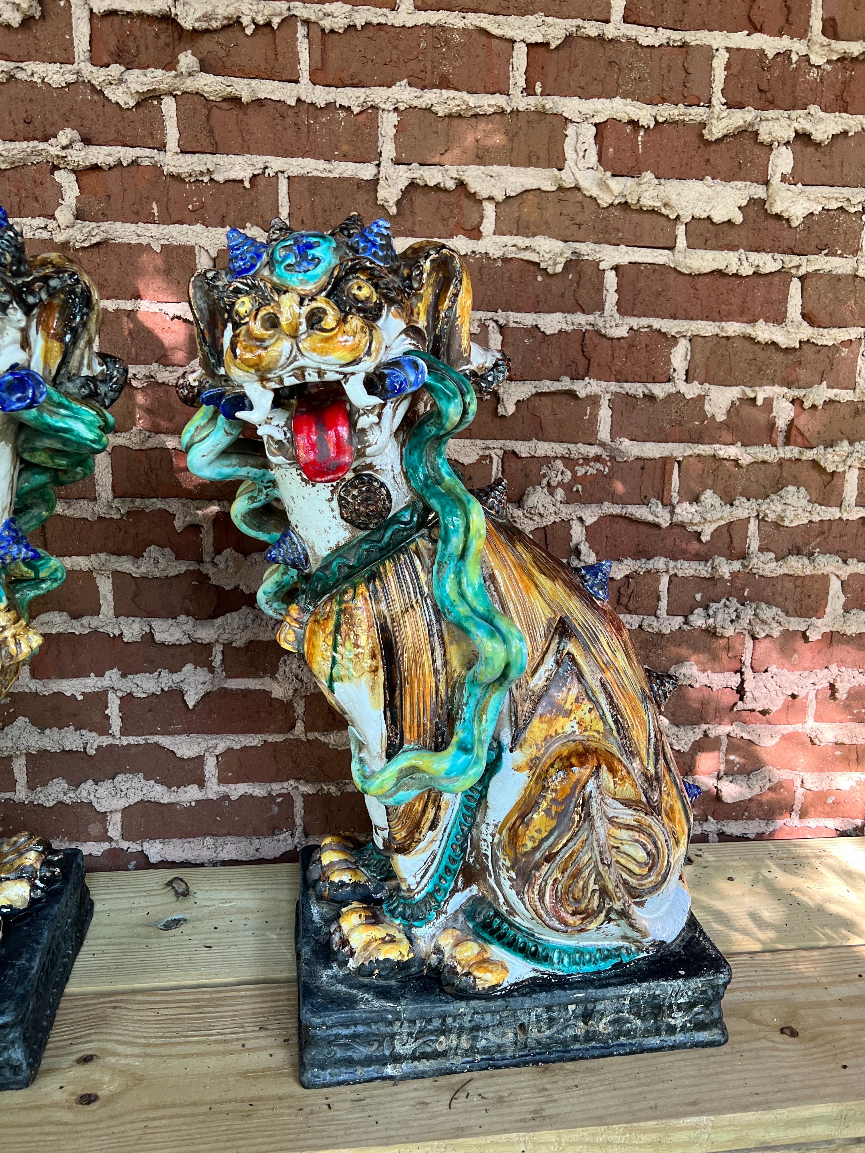 Large Scale Pair of Antique Majolica Ceramic Glazed Guardian Lions or Foo Dogs

These oversized Italian Majolica foo dogs showcase grotesque yet loveably cute features from their twisted fangs, snail shell horns, whispering hair and intricately