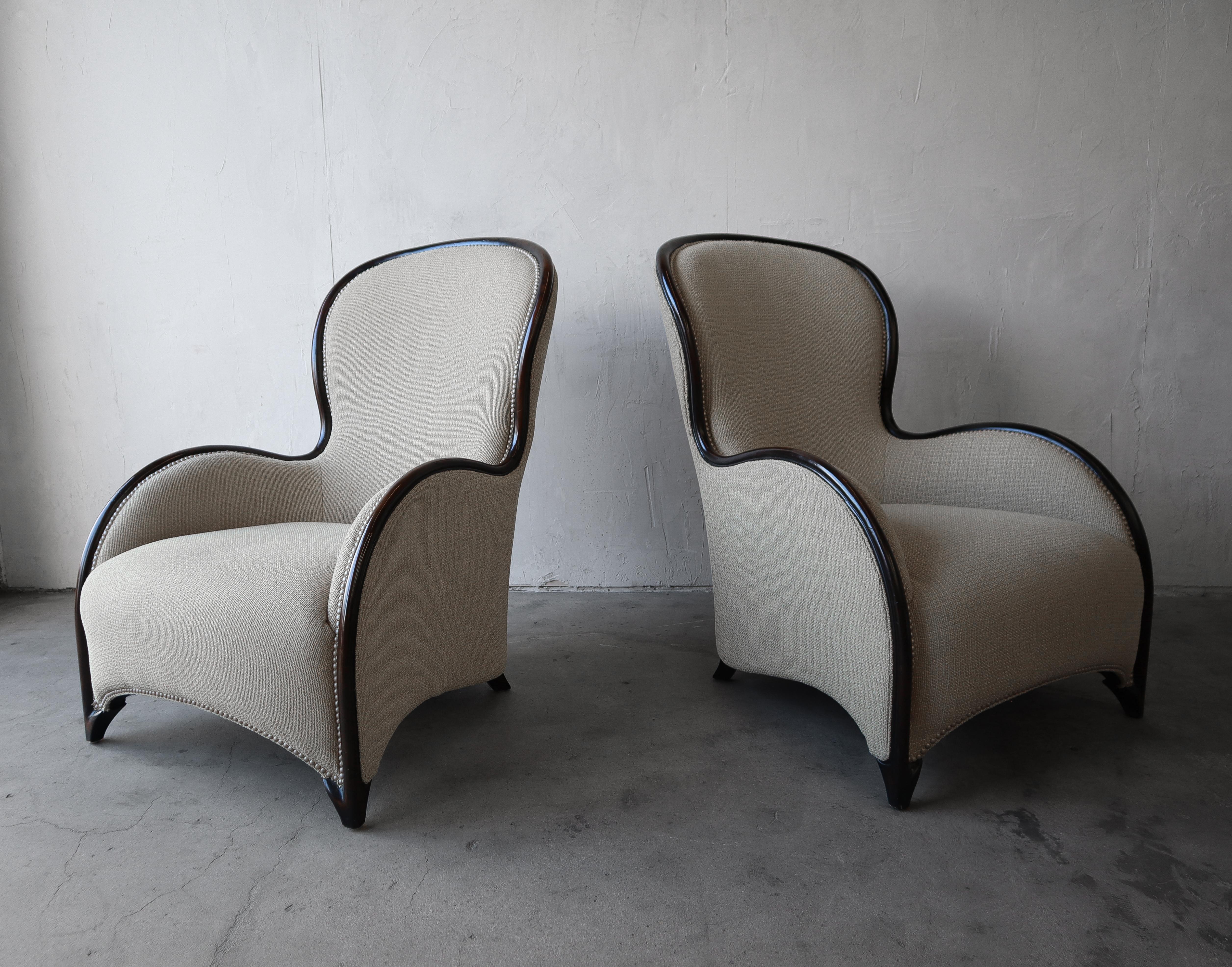 Gorgeous pair of large scale lounge chairs. These chairs have this most beautiful swooping silhouette from every angle. They will class up any space they are added to.

The chairs are dressed in a nice chunky chenille fabric that provides a nice