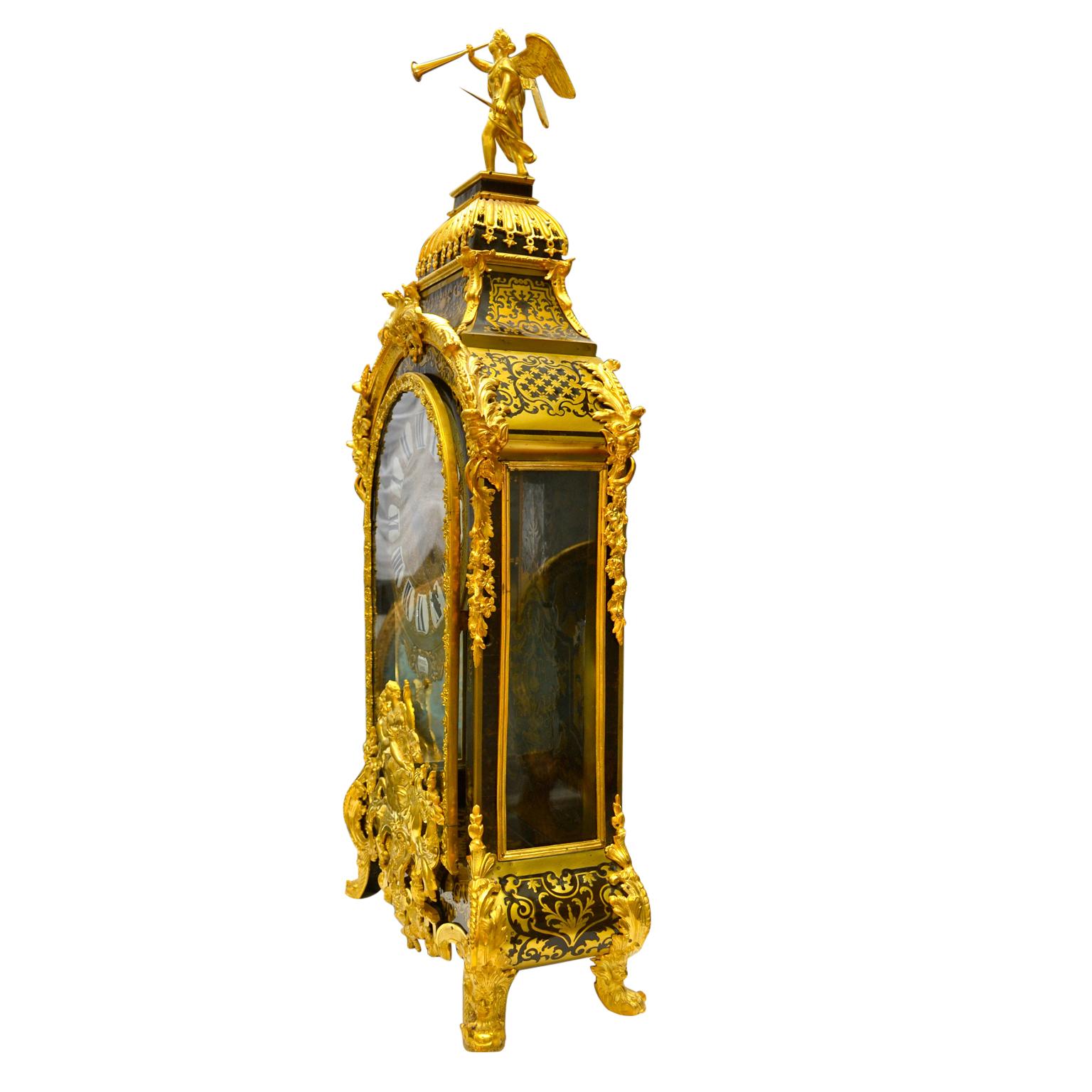 Grand scale boulle Cartel clock and matching plinth, the ebonized wood case is embellished all-over with gilded bronze mounts (re-gilt). The medallion below the clock dial shows a centaur (half man, half horse) carrying off a young maiden. On top of