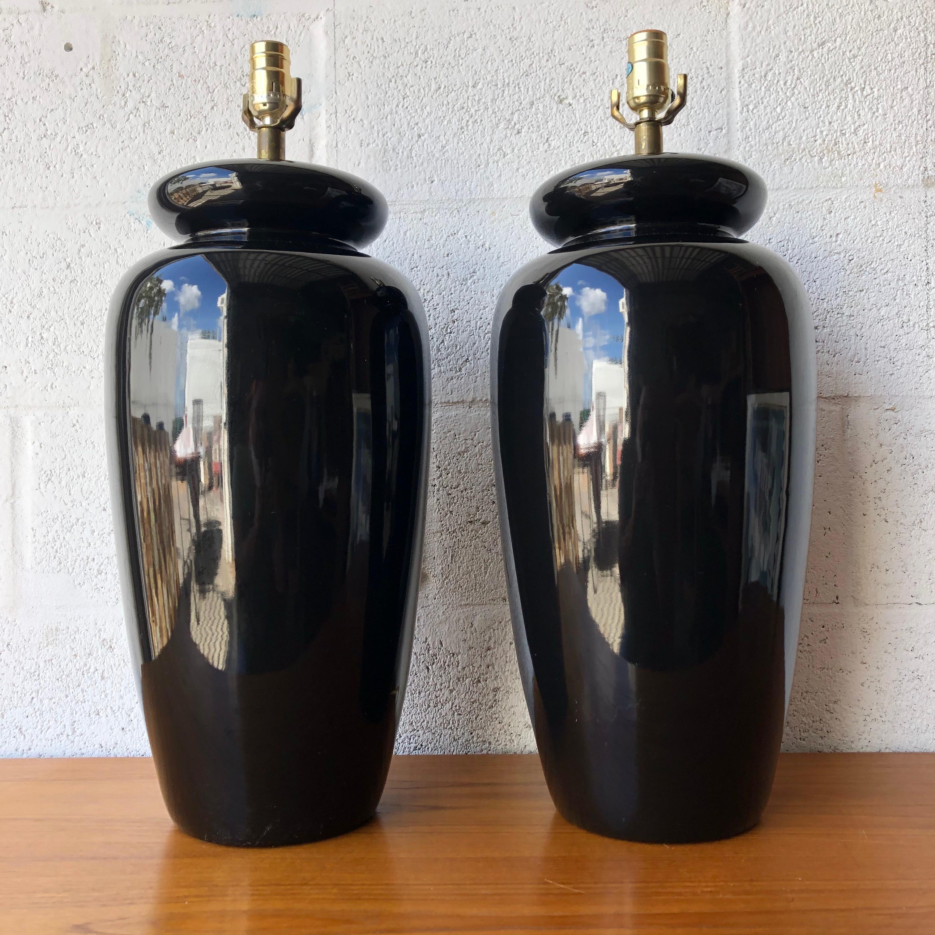 Vintage Large Scale Post Modern Art Deco Inspired Ceramic Table Lamps. C. 1980s 
Feature a black glossy ceramic finish and clean rounded lines very commonly seen on the late 70s and mid 80s. art deco revival style.
In excellent vintage condition