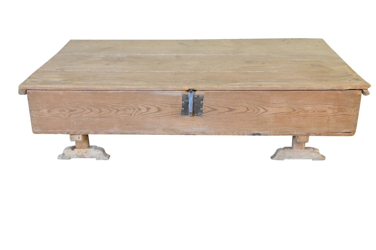 A very handsome Portuguese grand scale primitive coffee, trunk resting on its feet, now as a coffee table. Soundly constructed from pine. Great surface area and storage.
