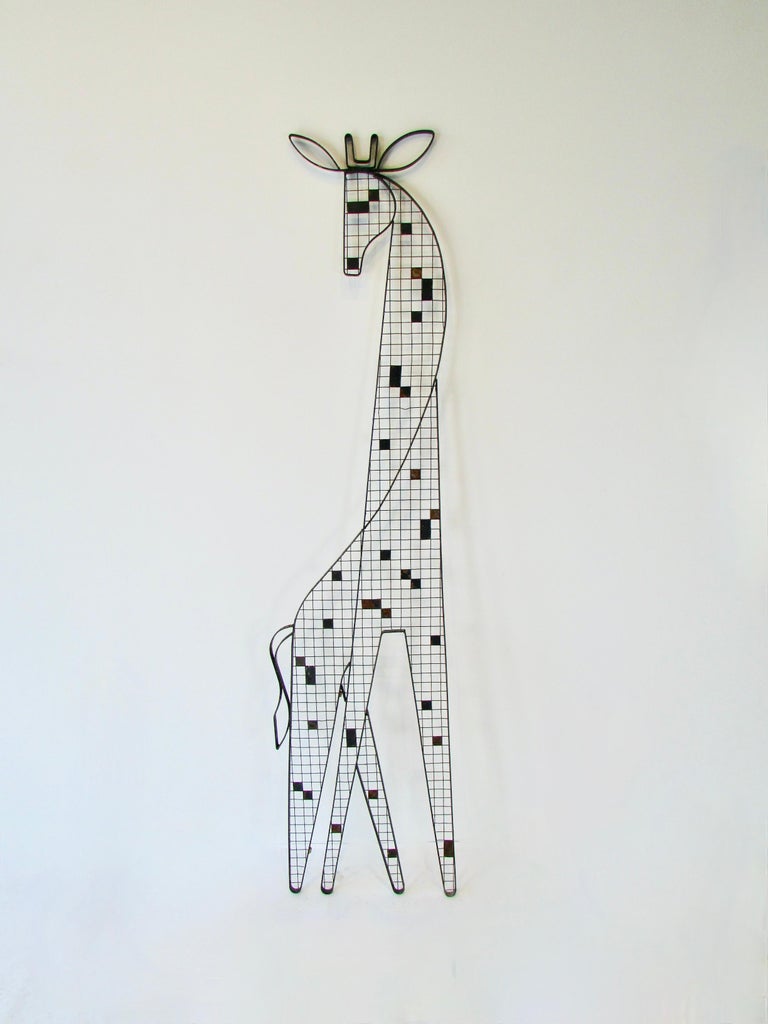 Beautifully flowing simple lines of flat band steel form these Giraffe wall sculptures. Backed by square wire grid steel. Designed by Frederick Weinberg of Philadelphia in the mid 1950s. Large scale wall hanging forms are scarce if not rare. This