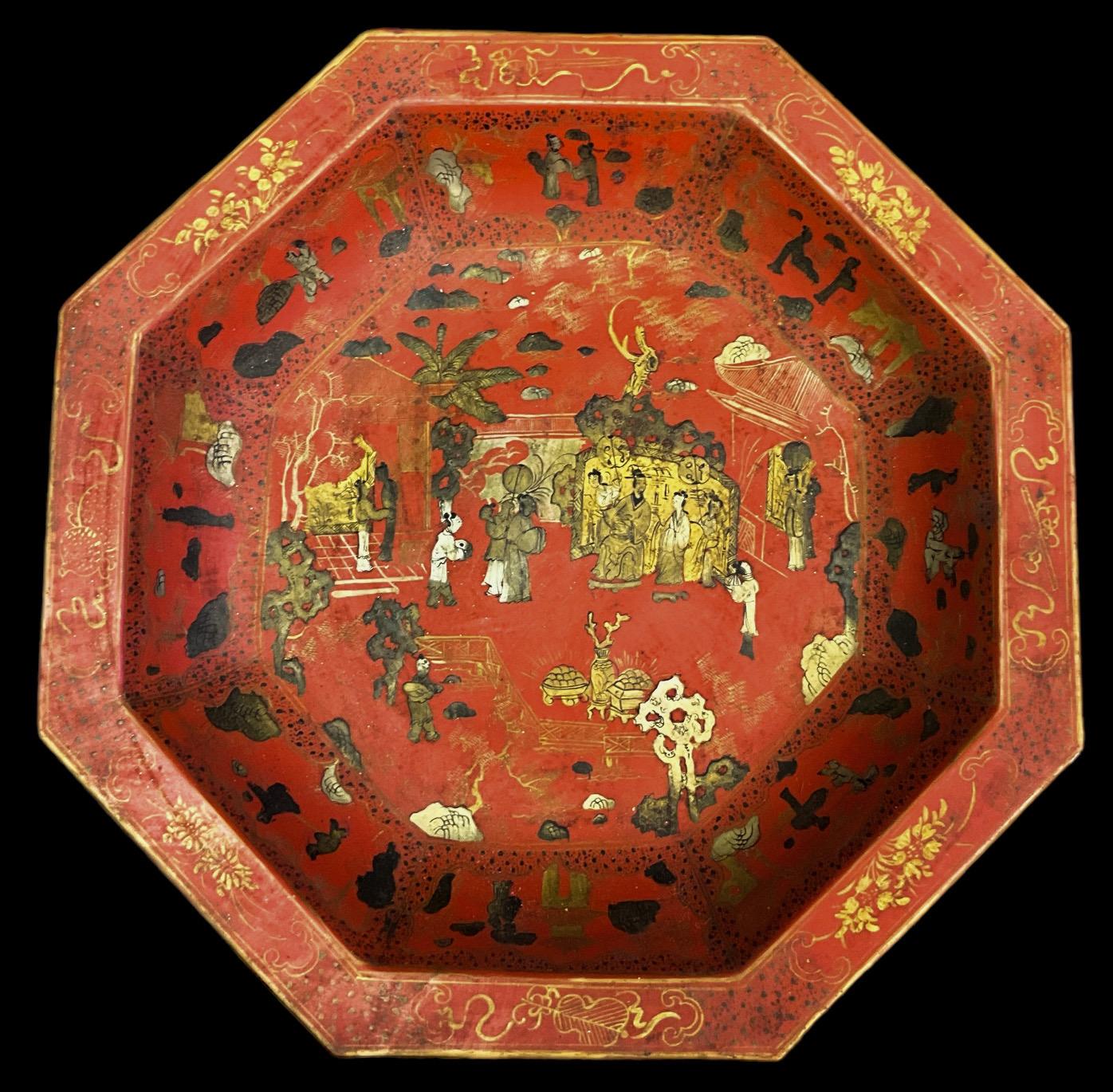 Very decorative! This is a large scale shallow bowl or platter with Chinese Export styling. It is a red with gilt pastoral scenes . It is in very good condition.