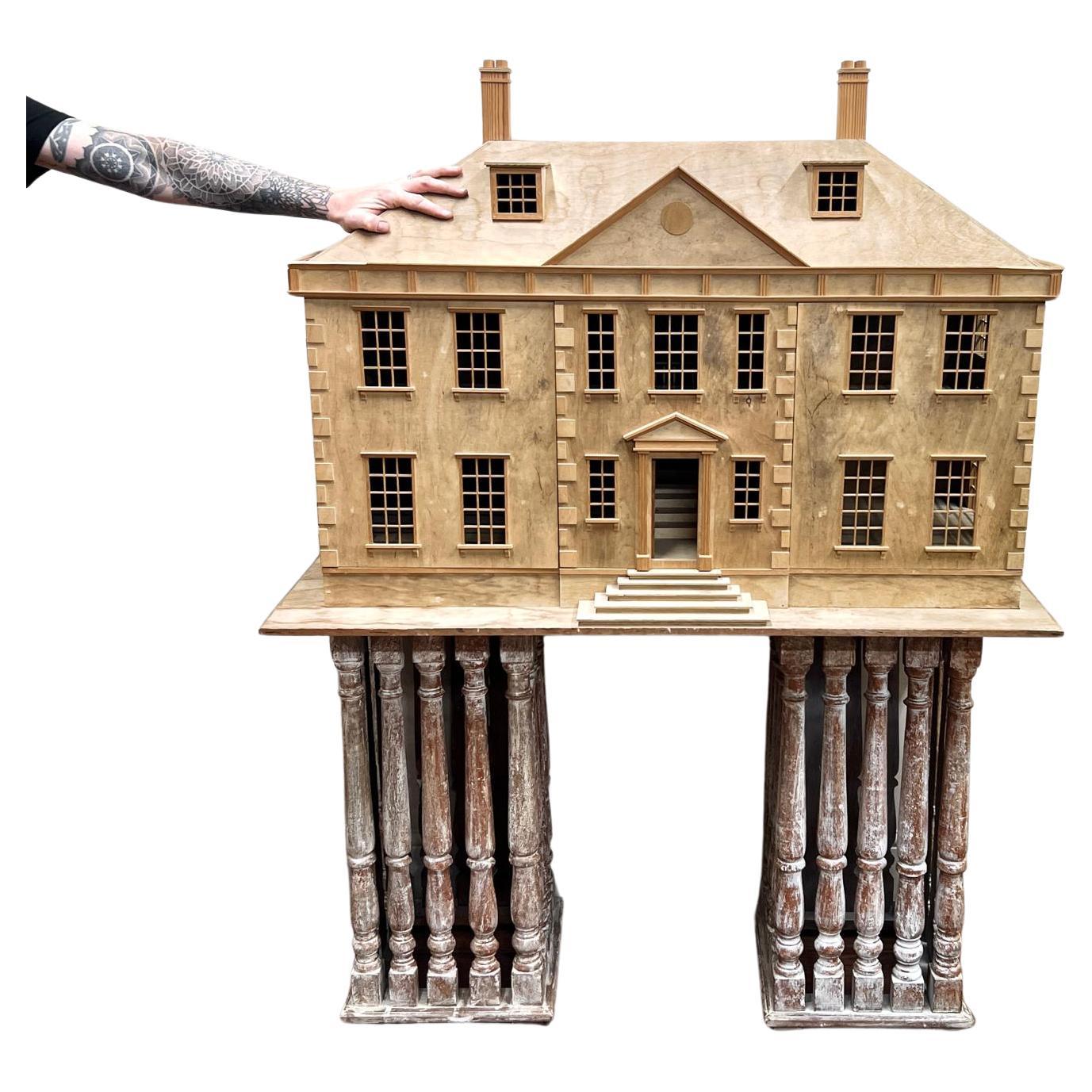 Scratch built large wooden Georgian house.
This was found in the loft of a grand house in Windsor, where it had been sat for years, possibly unfinished for the person who put in hours of work to make it.
The wonderfully dried out wood adds to the