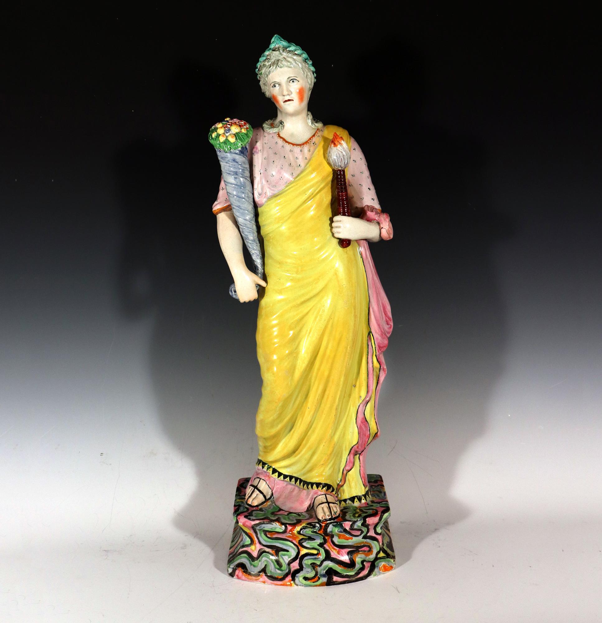 Massive Staffordshire Pearlware Pottery Figure of Ceres or Plenty,
circa 1815

This large scale figure of Ceres or Plenty is a stunning example of Staffordshire pottery. The figure is finely modeled and enamelled in colors, and she stands on a