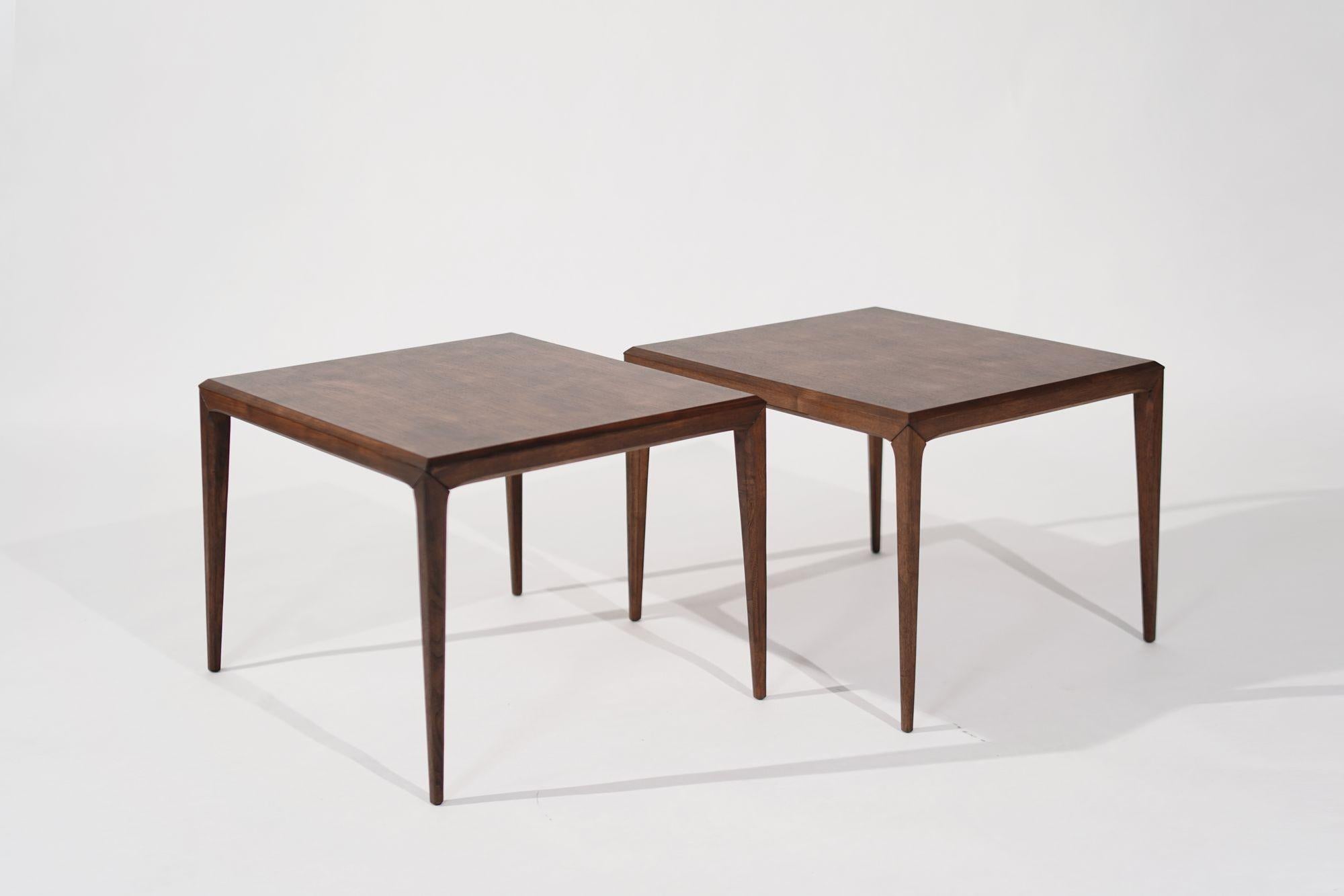 Enhance your space with this set of large-scale teak end tables by Johannes Andersen for CFC Silkeborg, Denmark, circa 1950s. Fully restored to their original elegance, these tables exhibit the timeless appeal of mid-century Danish design. With