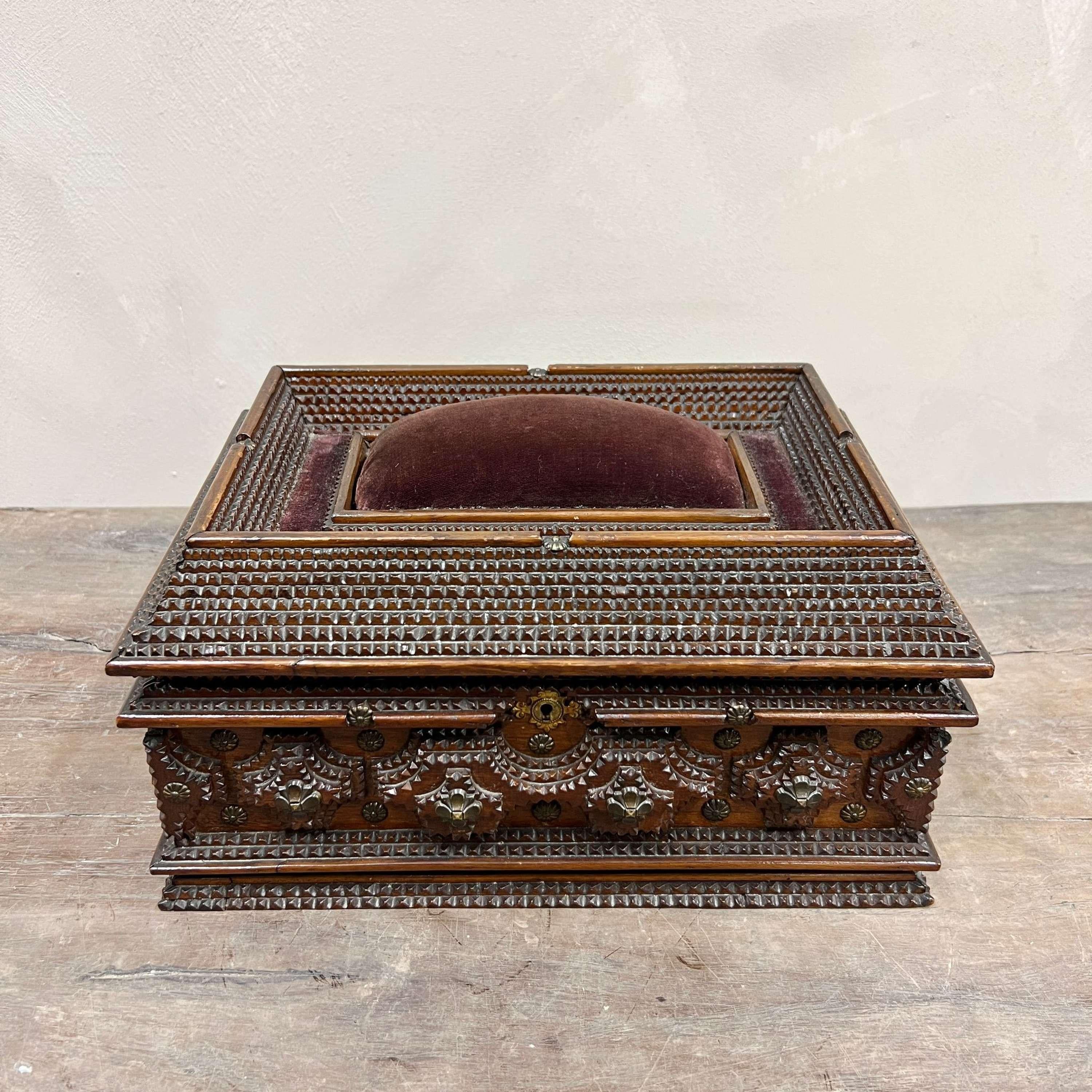 An early 20th century Tramp Art Jewellery/Sewing box, made from old cigar boxes.

With brass detail and handles and lined cushioned fabric inside.

Tramp art was made by untrained artisans during the 19th & 20th century & was made using easily