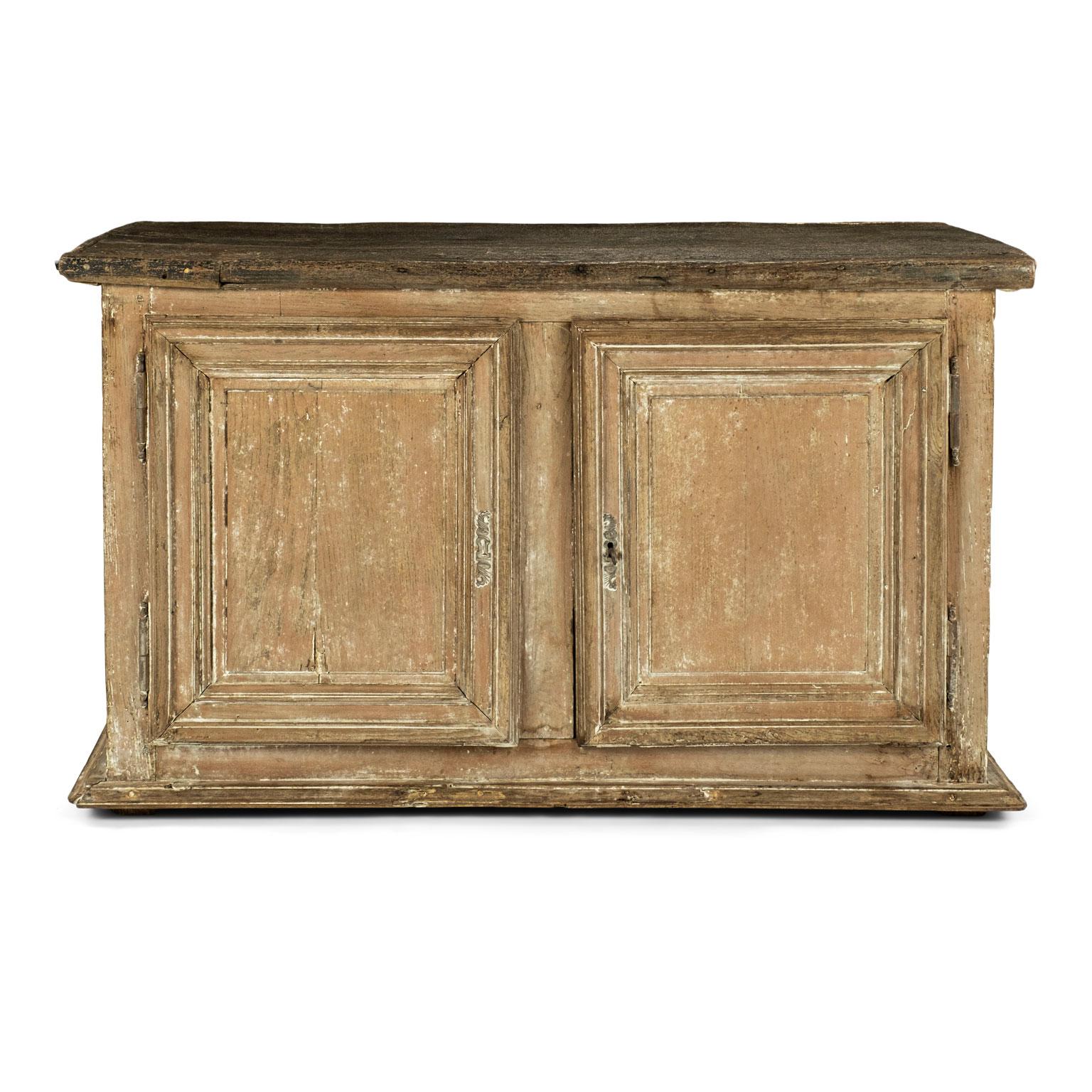 Large-scale two-door painted buffet dating to the 19th century. Mortise and tenon construction. Original trim molding applied around doors and lower edge. Scraped finish. Working lock. Rustic top is not original, but created from antique wood. Long
