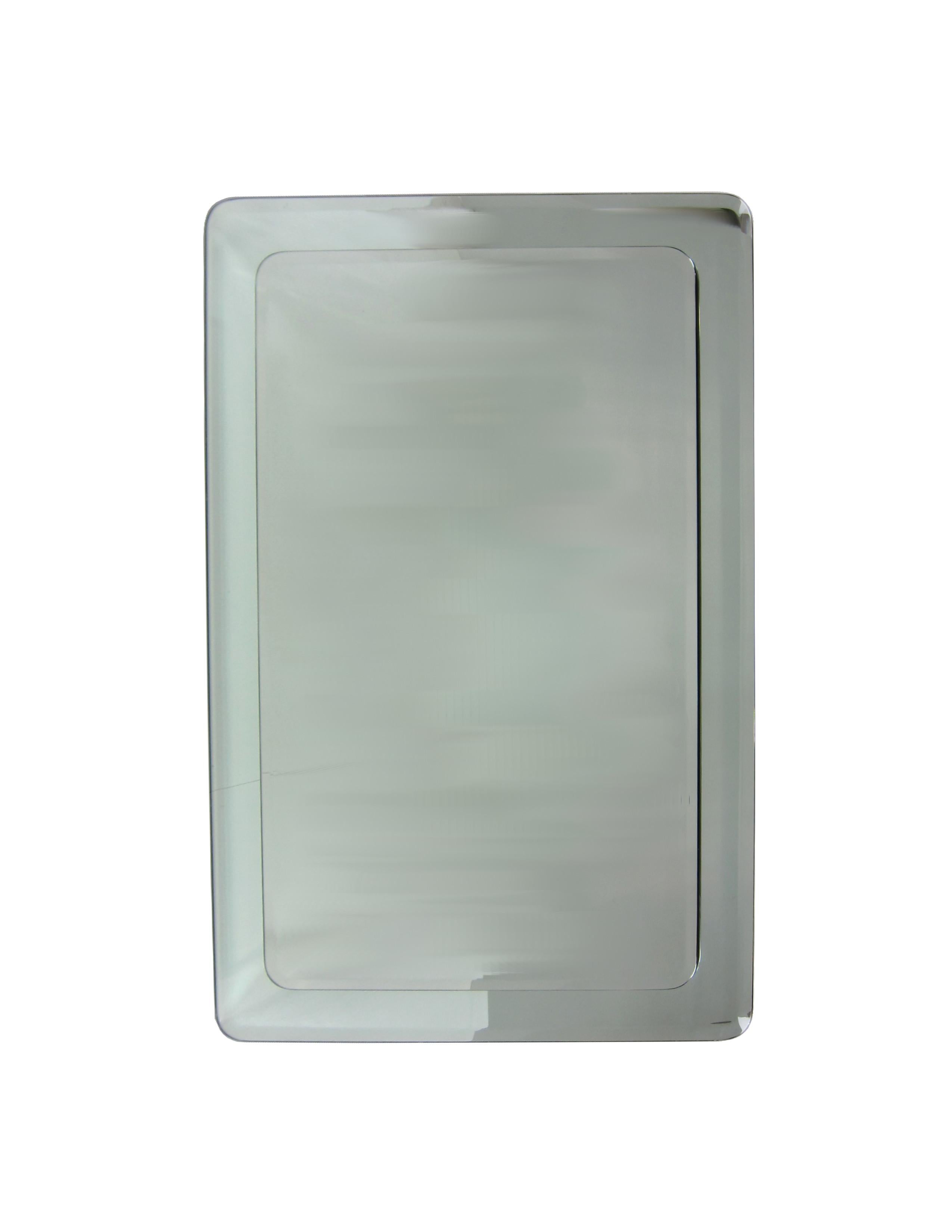 Impressive bevelled rectangular mirror with radiused corners framed by a larger mirror. Back panel has inset hardware for hanging either vertical or horizontal. Top quality materials and workmanship.