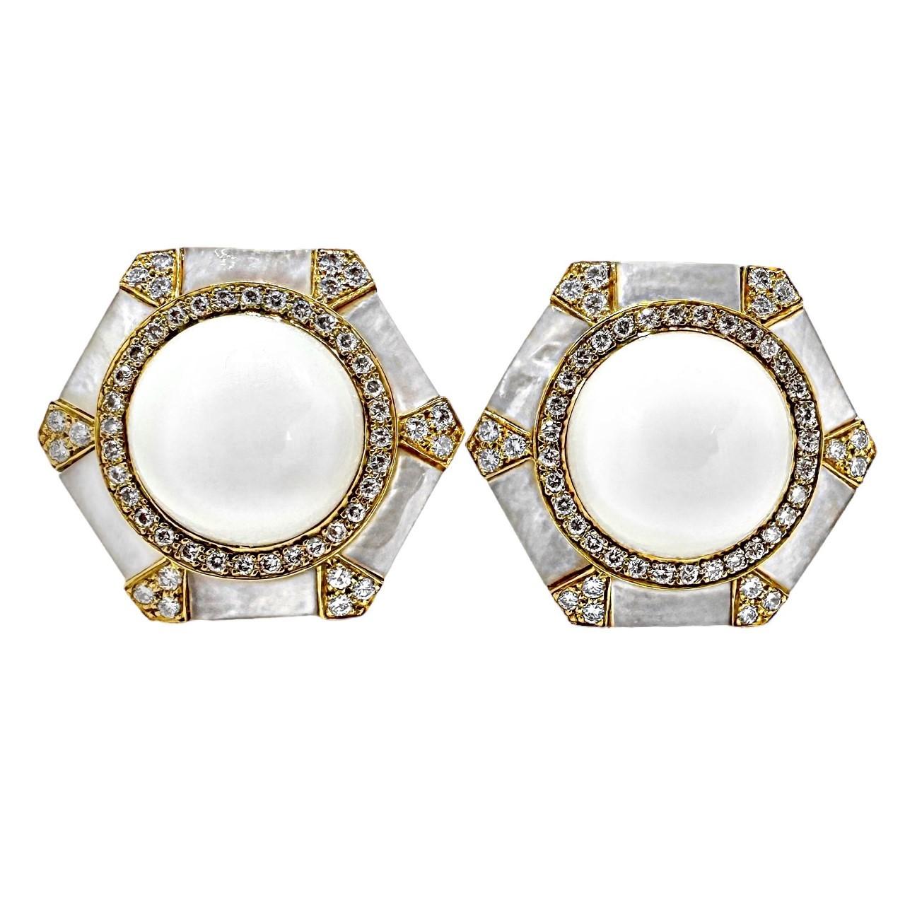This unique and elegant vintage pair of 18K yellow gold hexagonal earrings was imagined and created by highly regarded designer, Albert Lipten.  At their center are 16mm natural snow white onyx cabochons which are surrounded by panels of luminescent