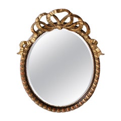 Grand miroir ovale Napoléon III à grande échelle en bois ébénisé et doré