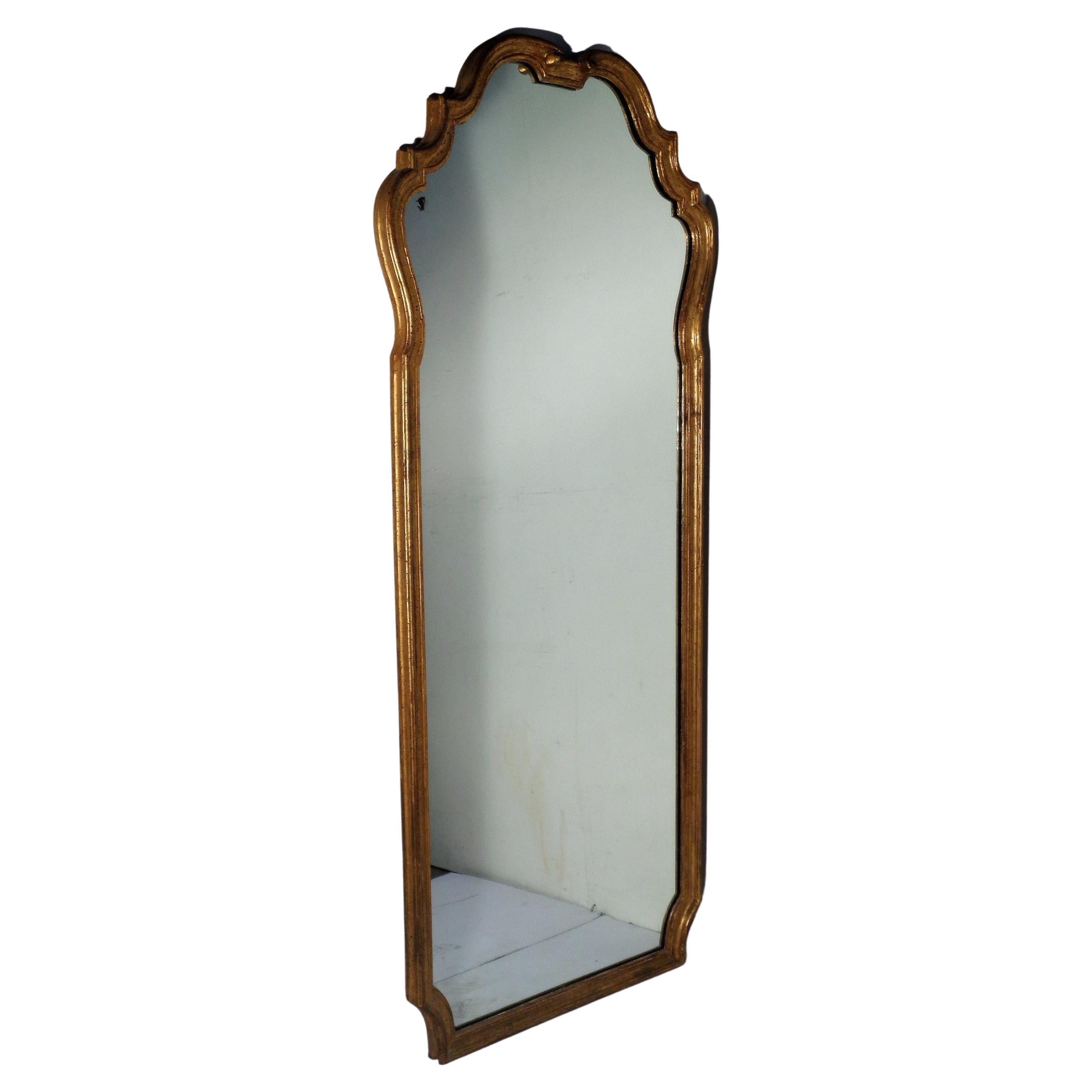 Large hand carved scalloped giltwood mirror w/ faux marbleized top gilded pier floor console. Overall beautifully aged original gilded surface color patina. Metal tag, paper label. stamped on backboard. Hand Made by Pino De Luca Inc., Italy. Circa