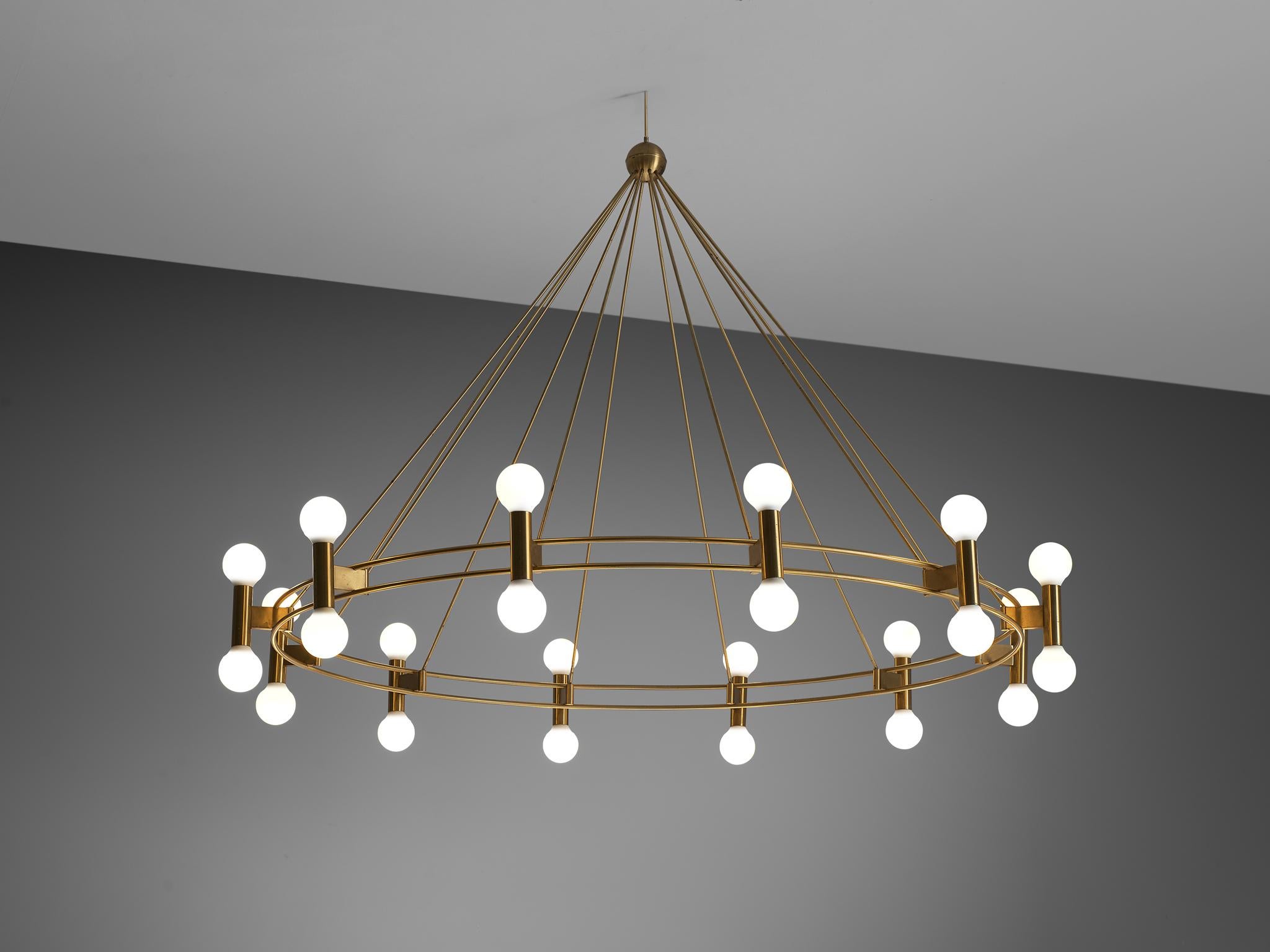 Chandelier, brass, Scandinavia, 1960s.

This large chandelier is made in the 1960s in Scandinavia and shows typical Scandinavian modern traits in its modest en minimalistic design. The chandelier consists of two large, thin circular frames that
