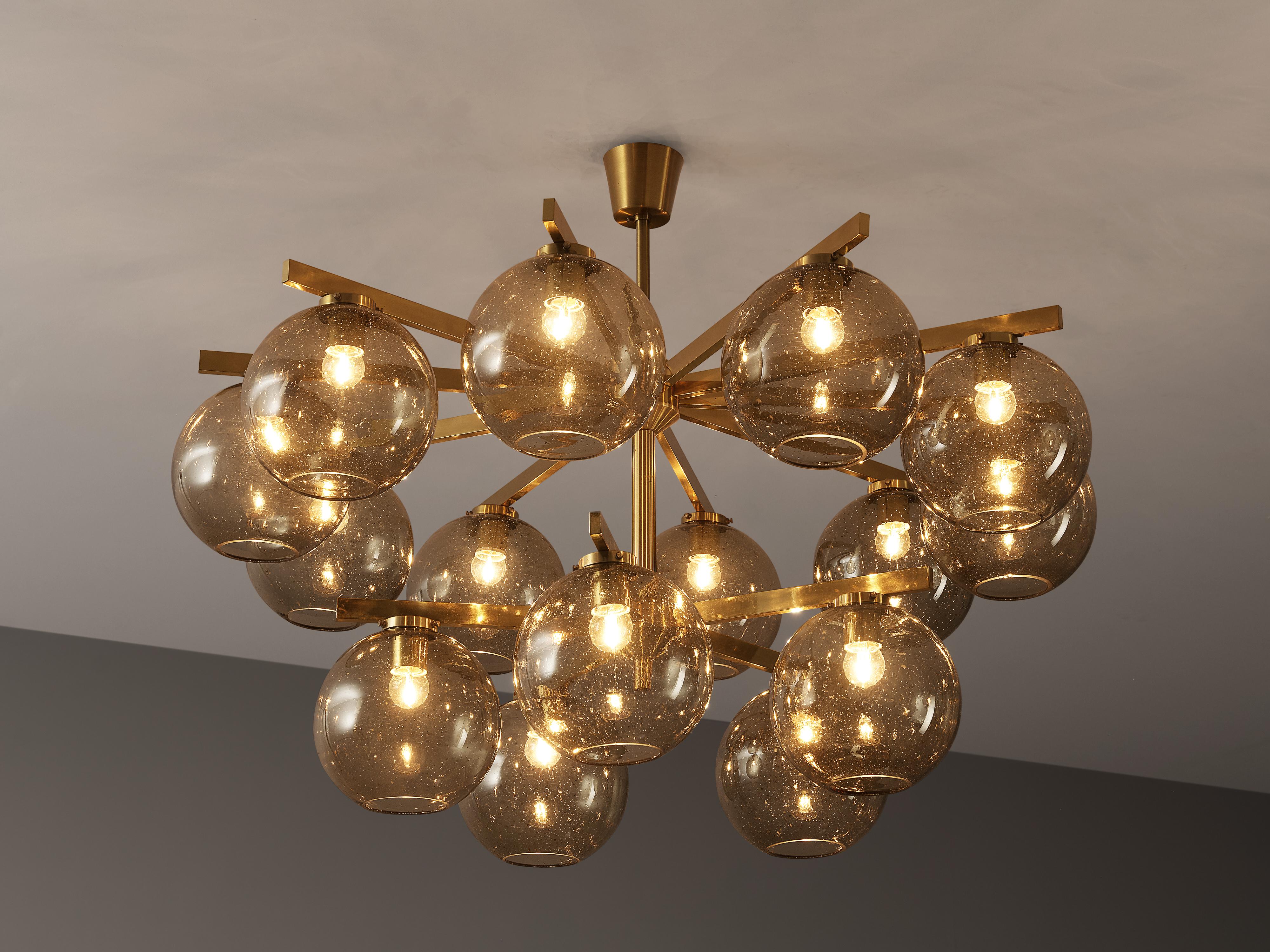 Chandelier, brass, smoked glass, Scandinavia, 1960s

This wonderful chandelier strongly resembles the work by the Swedish designer Hans-Agne Jakobsson. Fifteen smoked glass spheres are attached to the brass frames on two levels. Therefore, the