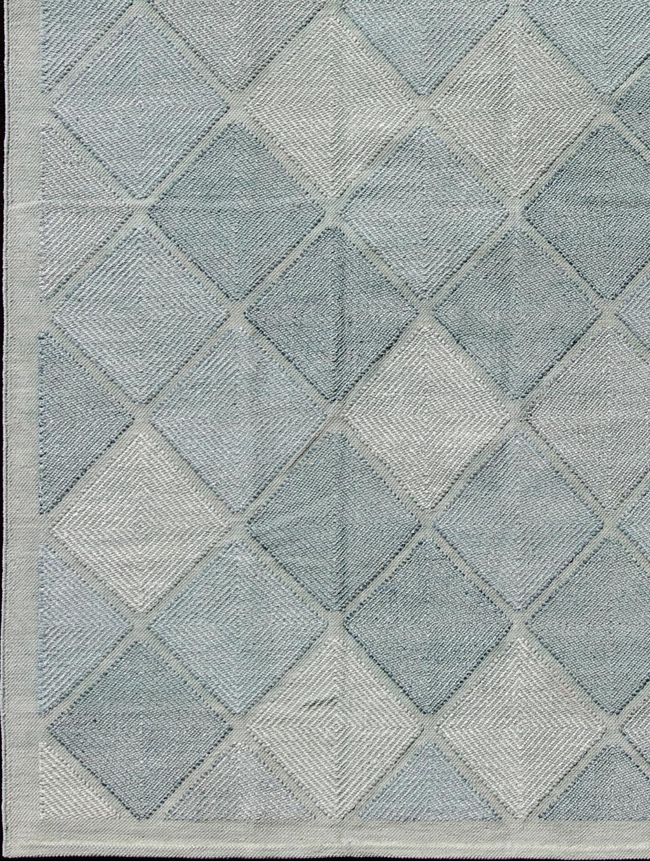 Large Scandinavian inspired design rug in blue and gray colors.
This Scandinavian large rug is inspired by the work of Swedish textile designers of the early to mid-20th century. With a unique blend of historical and modern design, this dynamic and
