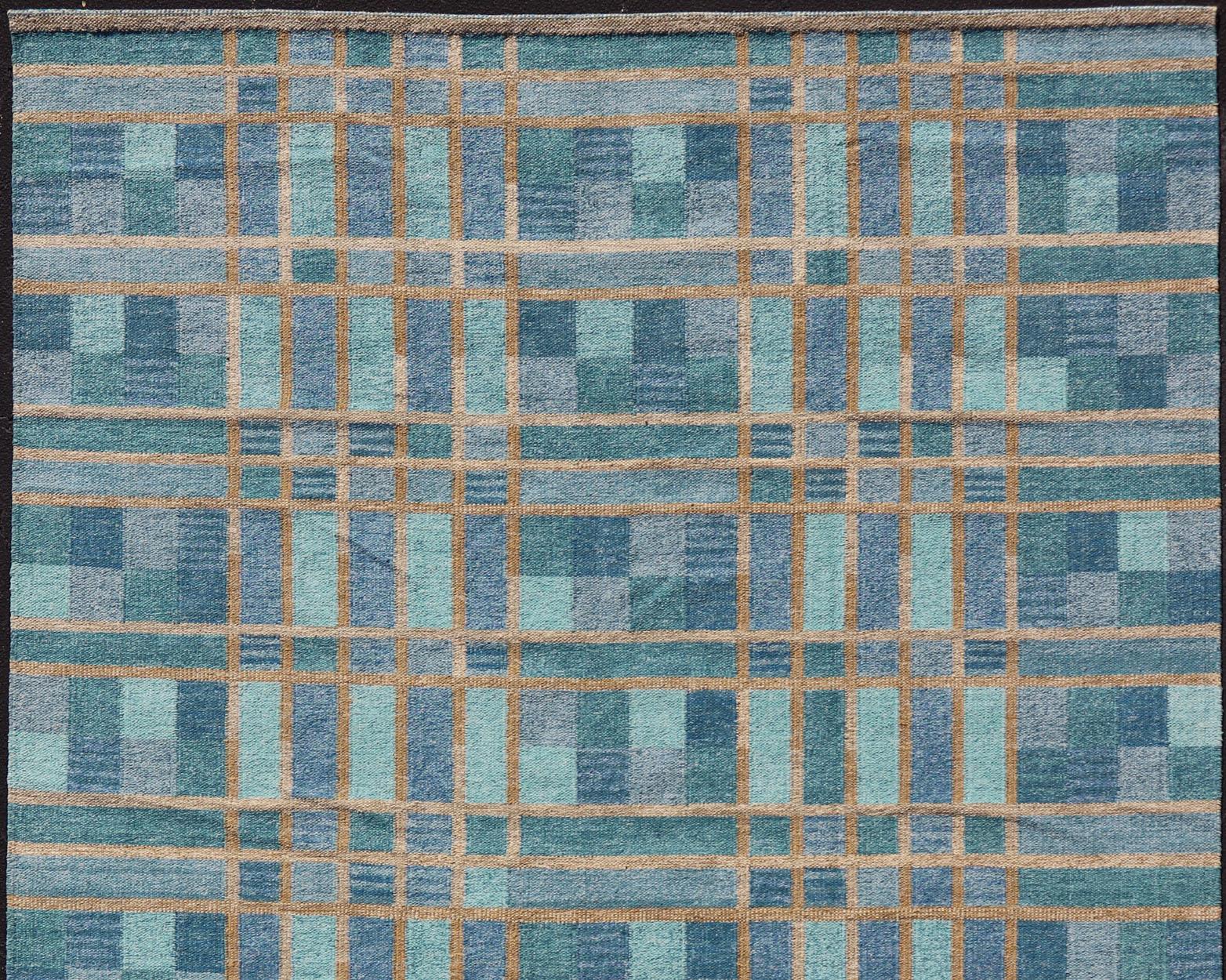 Large Scandinavian inspired design rug in blue and grey colors.
Keivan Woven Arts / rug/RJK-44521-DHB-047.
This Scandinavian large rug is inspired by the work of Swedish textile designers of the early to mid-20th century. With a unique blend of