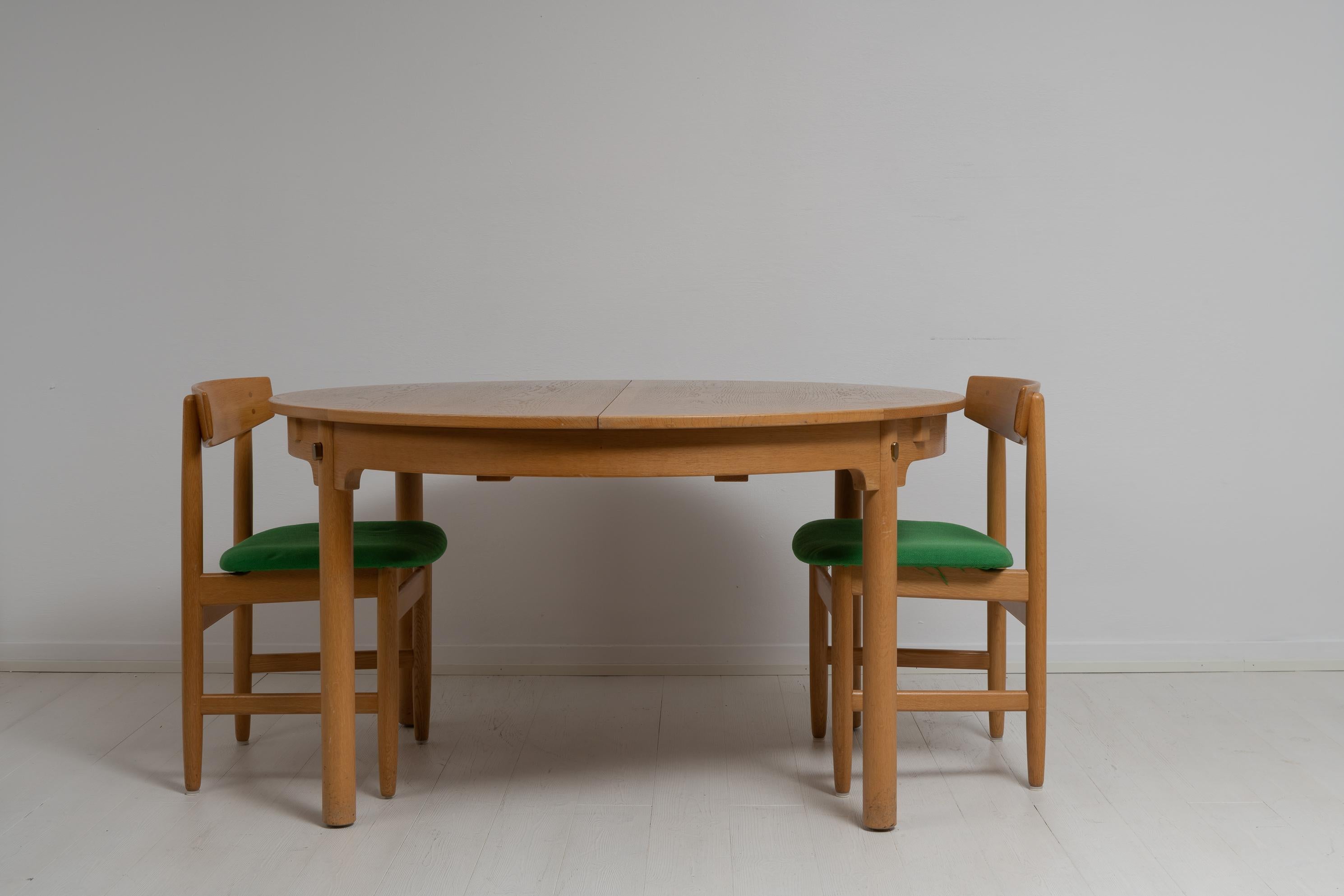 Øresund large round dining table designed by Børge Mogensen and made by Karl Andersson & Söner. The large dining table is in oak and made in Sweden around the mid-20th century, 1950 to 1960. The table is subtly but unmistakably Scandinavian modern