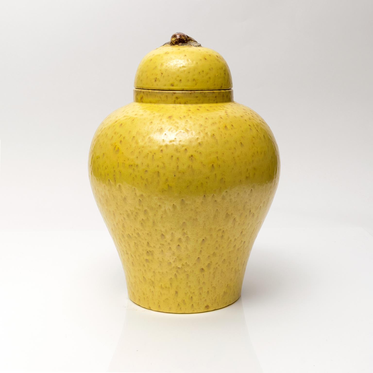 A large glazed ceramic jar with lid designed by Jerk Werkmaster for Nittsjo, Sweden, 1930s. The lid is decorated with a piece of fruit and a few leaves. 

Dimensions: H 7.5