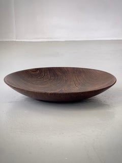 Large scandinavian serving bowl in hand carved dark hard wood. Finland 1960s.