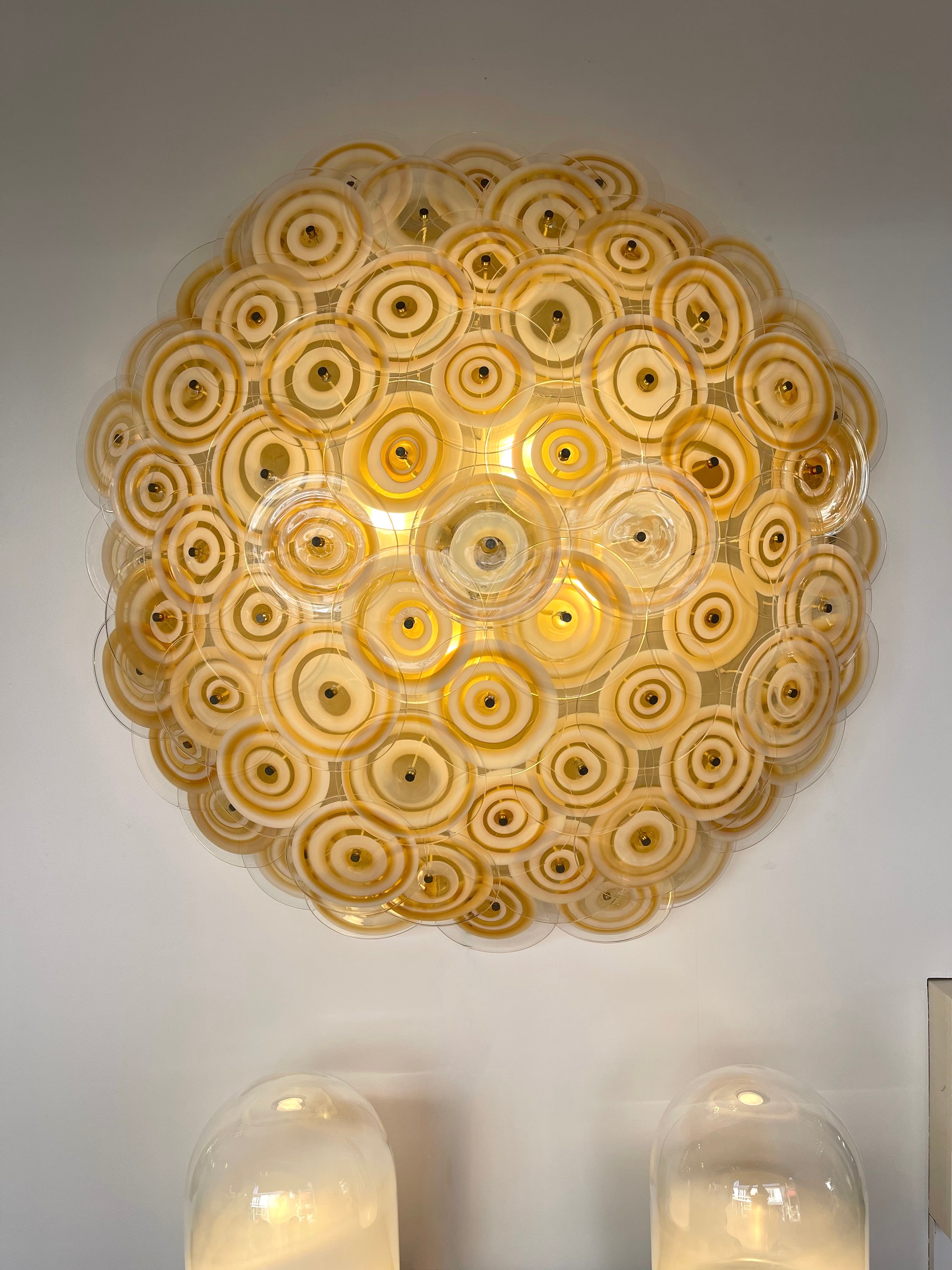 Very rare oversize large sun wall light lamp pannel sconce in white lacquered metal and yellow orange murano glass disc by the italian master glass artist Gianmaria Potenza for the Murano manufacture La Murrina. He is the founder of La Murrina at
