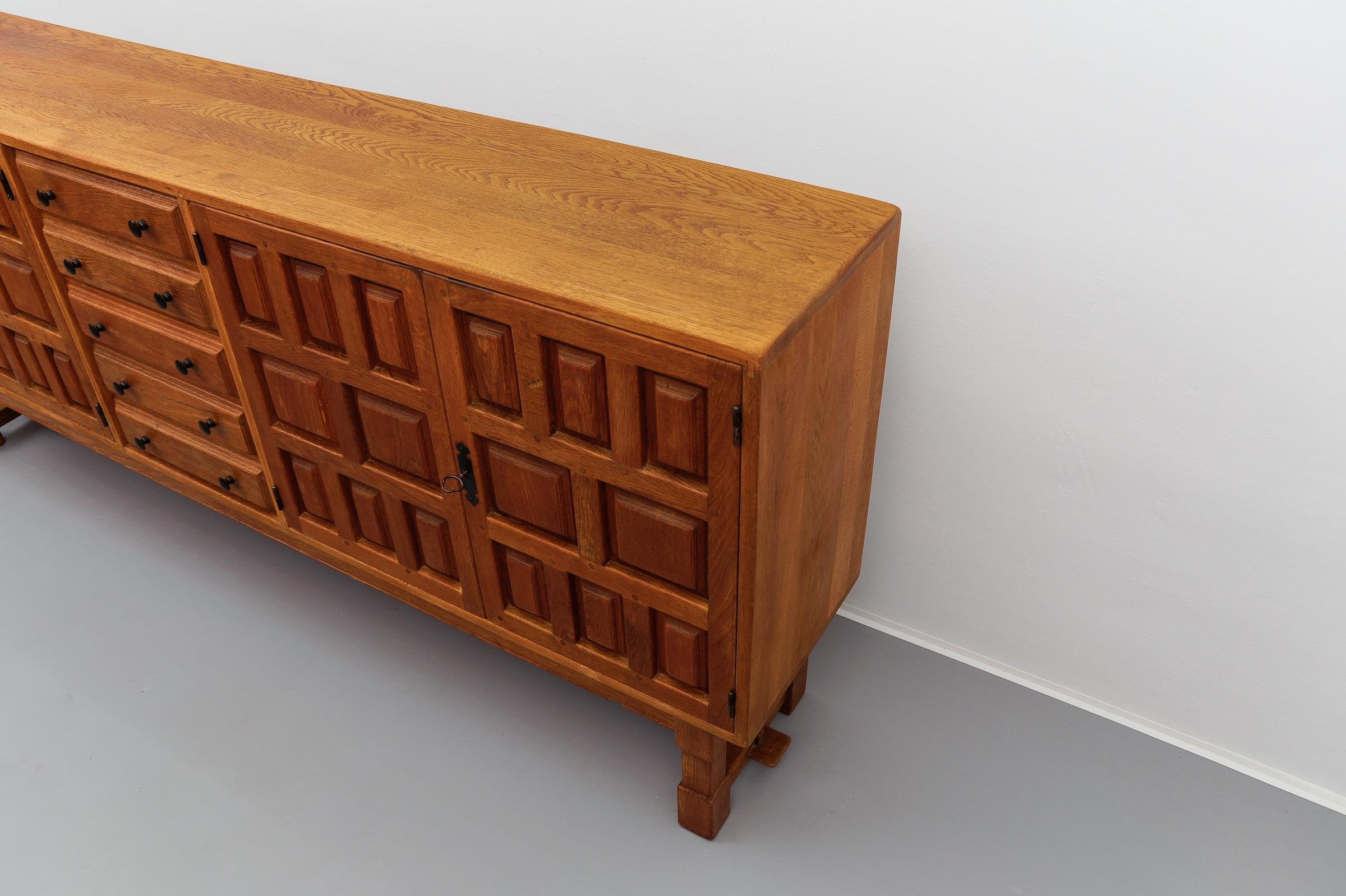Large screwless sideboard made of carved oak, Spain, 1960s For Sale 11