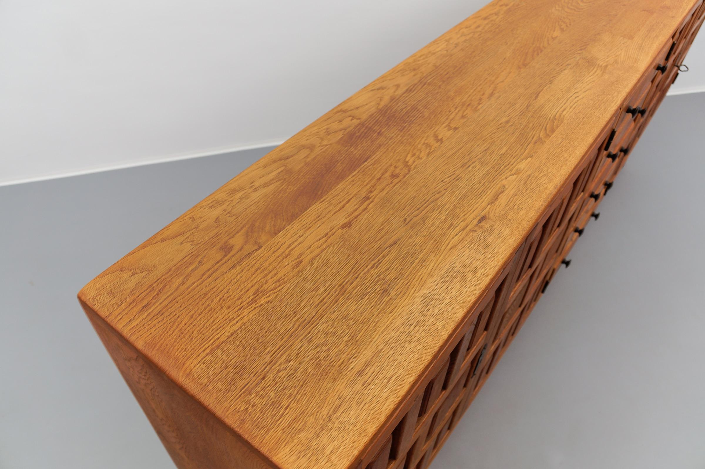 Large screwless sideboard made of carved oak, Spain, 1960s For Sale 13