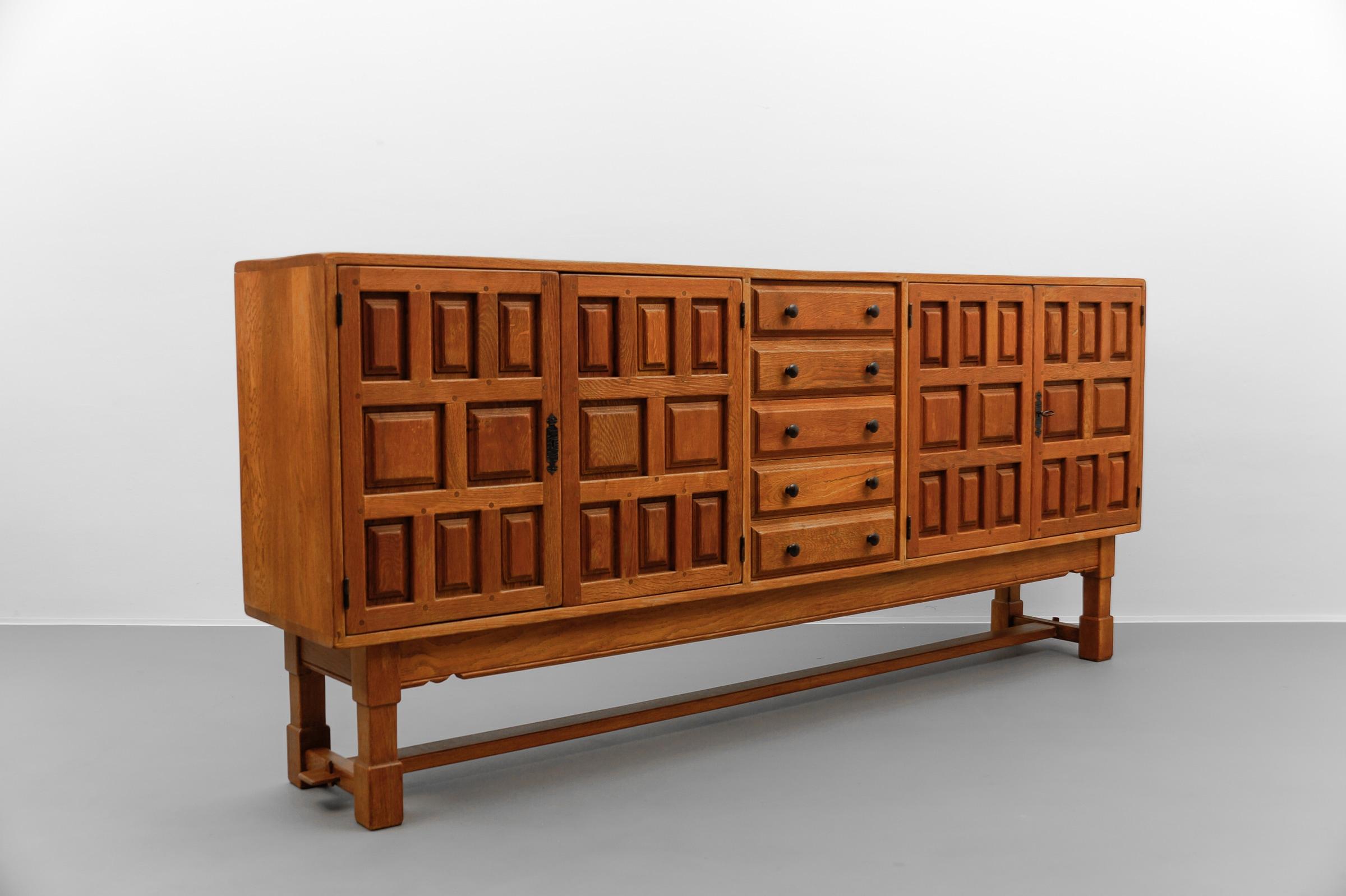 Scandinavian Modern Large screwless sideboard made of carved oak, Spain, 1960s For Sale