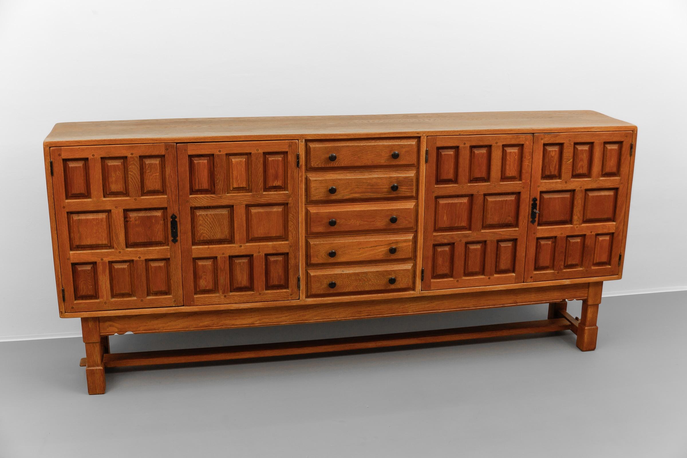 Spanish Large screwless sideboard made of carved oak, Spain, 1960s For Sale