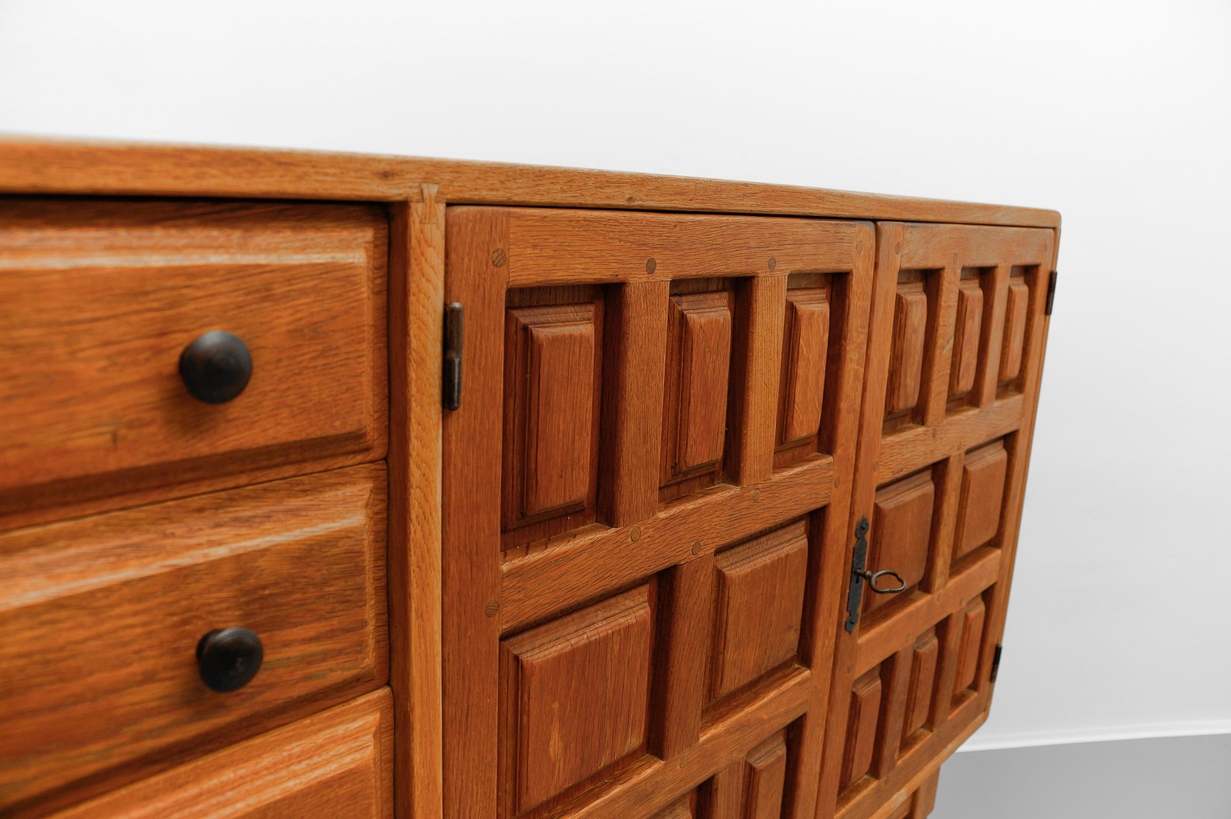 Oak Large screwless sideboard made of carved oak, Spain, 1960s For Sale