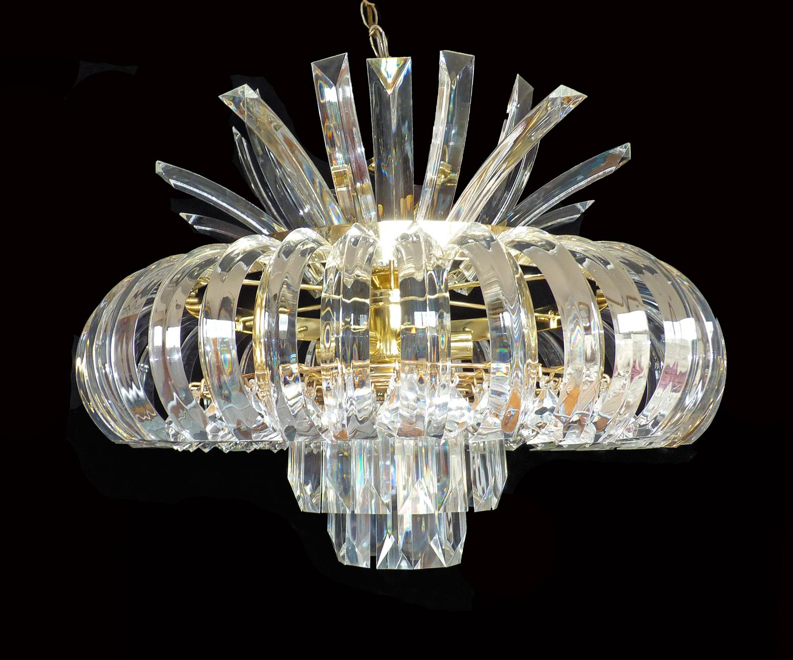 Large sculptural Italian curved Lucite gilt 9-light sparkly, 6 tiers wedding cake chandelier. Pair available.
A very nice 1970 light, it could be hung flush or hanging on a chain, if you want it flush, it could be only 10 inch high, or 20 inch if