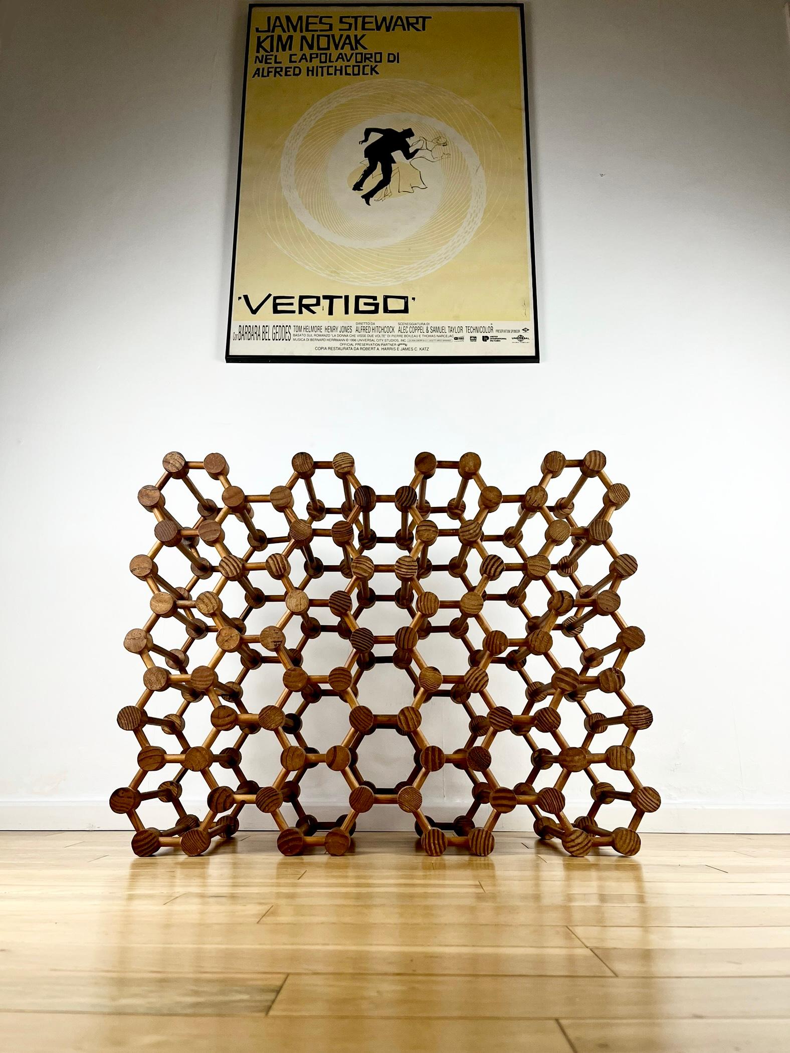 This awesome geometric design dates from the 1960s and can hold up 36 bottles!
It’s reminiscent of the Richard Nissen designed Danish wine racks from the same era, although those have square holes… this atomic, honeycomb version is a particularly