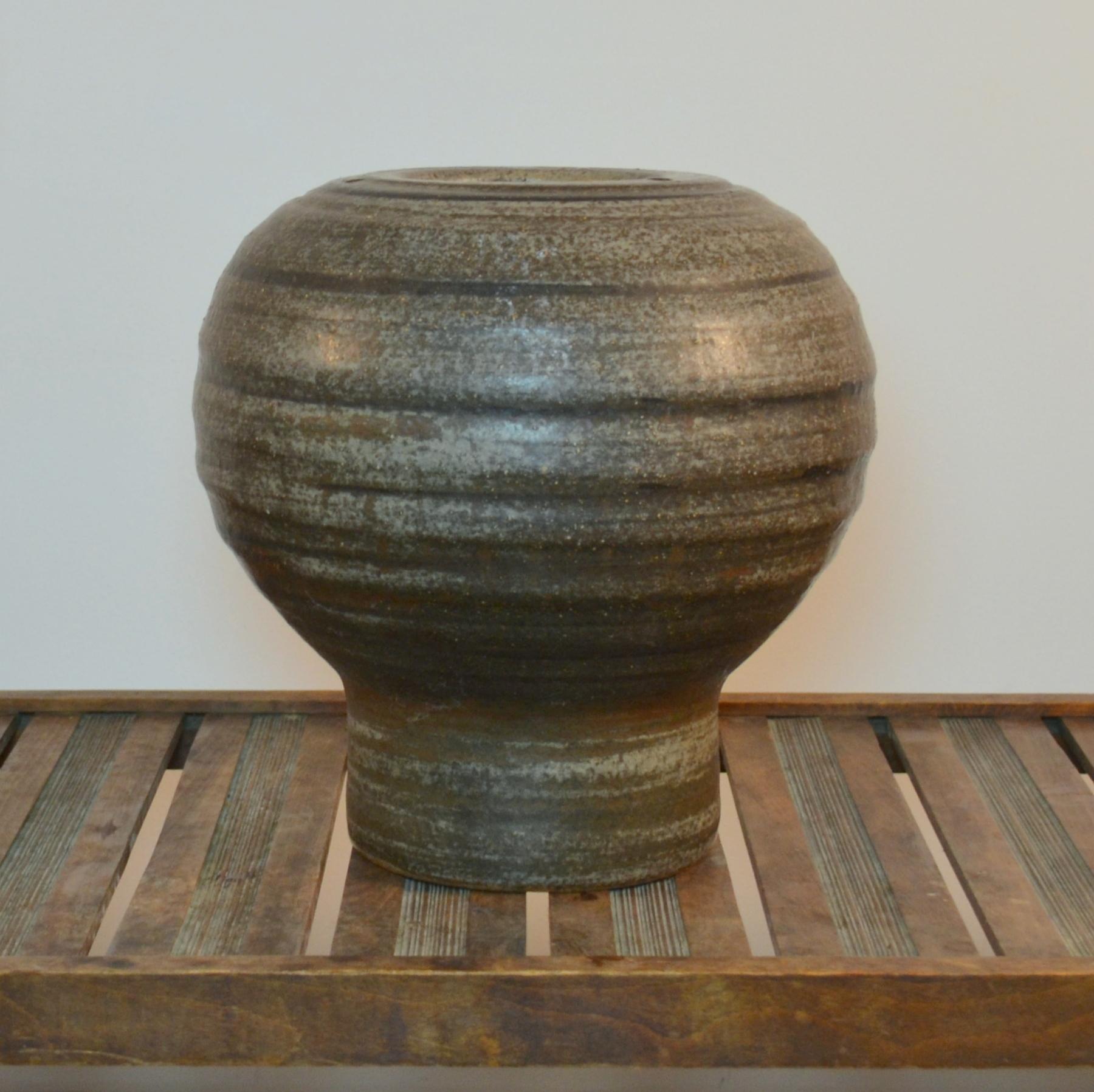 Large ball shape sculptural Studio Pottery vase created on the turning wheel by highly technical skilled Dutch ceramist Piet Knepper in the 1980's. The glaze in tones of grey is created by natural resources and is highly influenced by leading