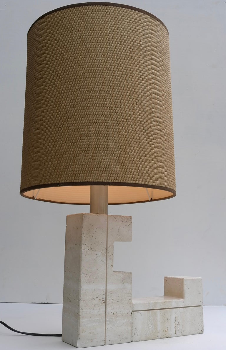 Large Sculptural Travertine table lamp, France 1970's.
You can turn the base from the lamp and put it in different shapes.
Height including the shade 71cm, diameter shade 36cm.