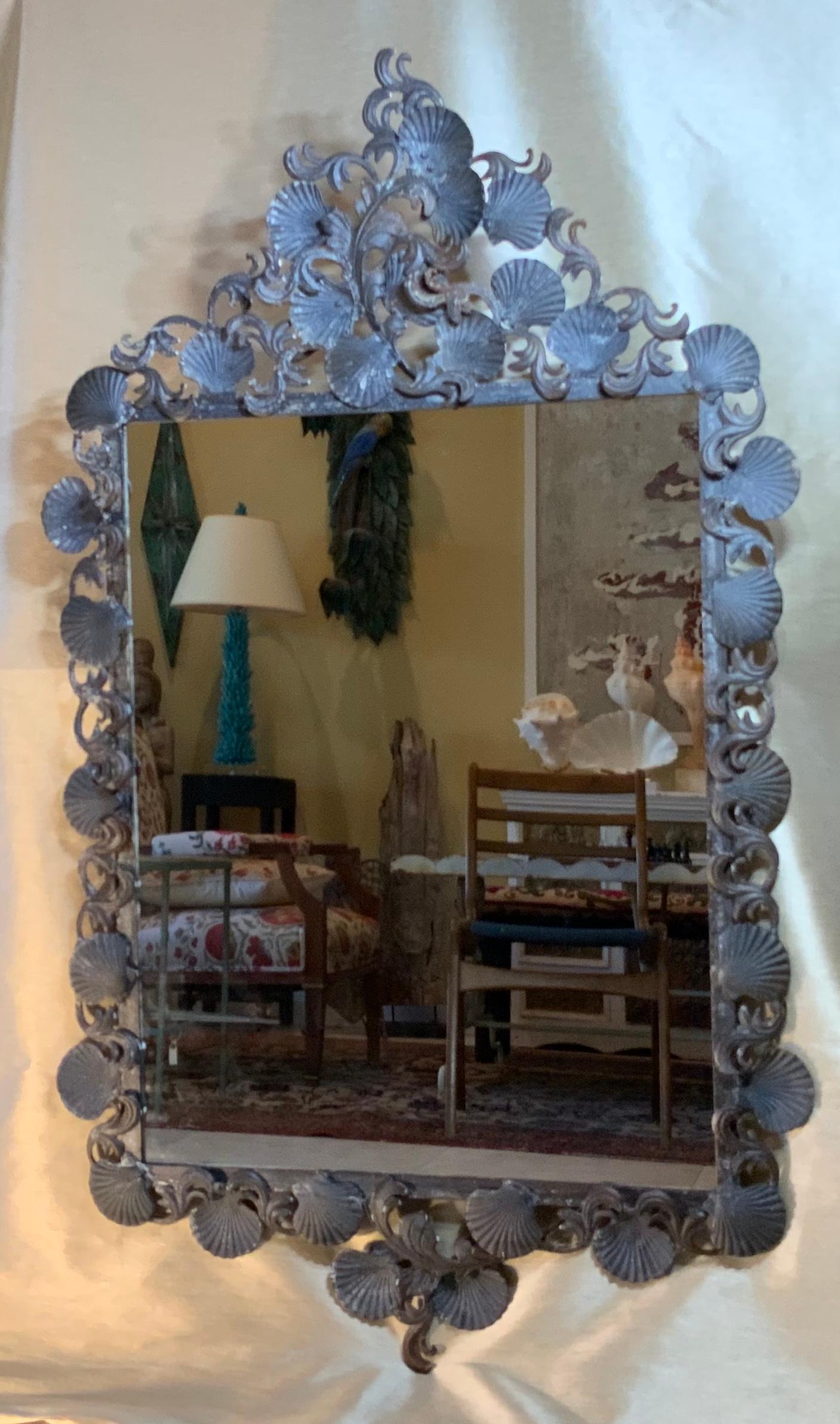 Elegant mirror made of forged and cast iron; all decorated with shells and sea star motifs.
Treated for rust.
Great patina.
Mirror size only: 26”.5 x 32”.25.