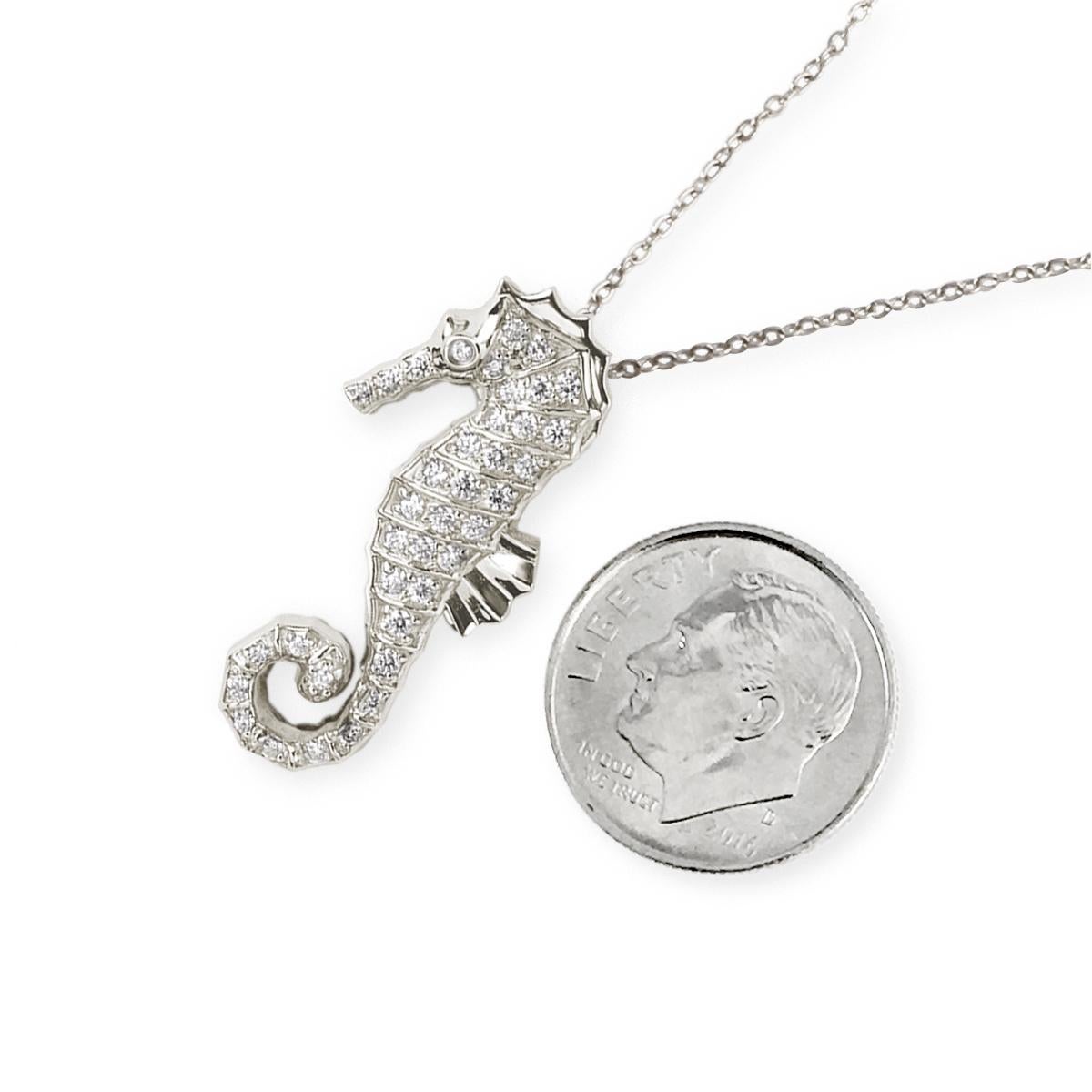 By Special Order only
Experience the enchantment of the sea with our Large Seahorse Diamond Pendant in White Gold. Crafted with meticulous attention to detail, this limited edition piece features 39 brilliant-cut round diamonds intricately pave set