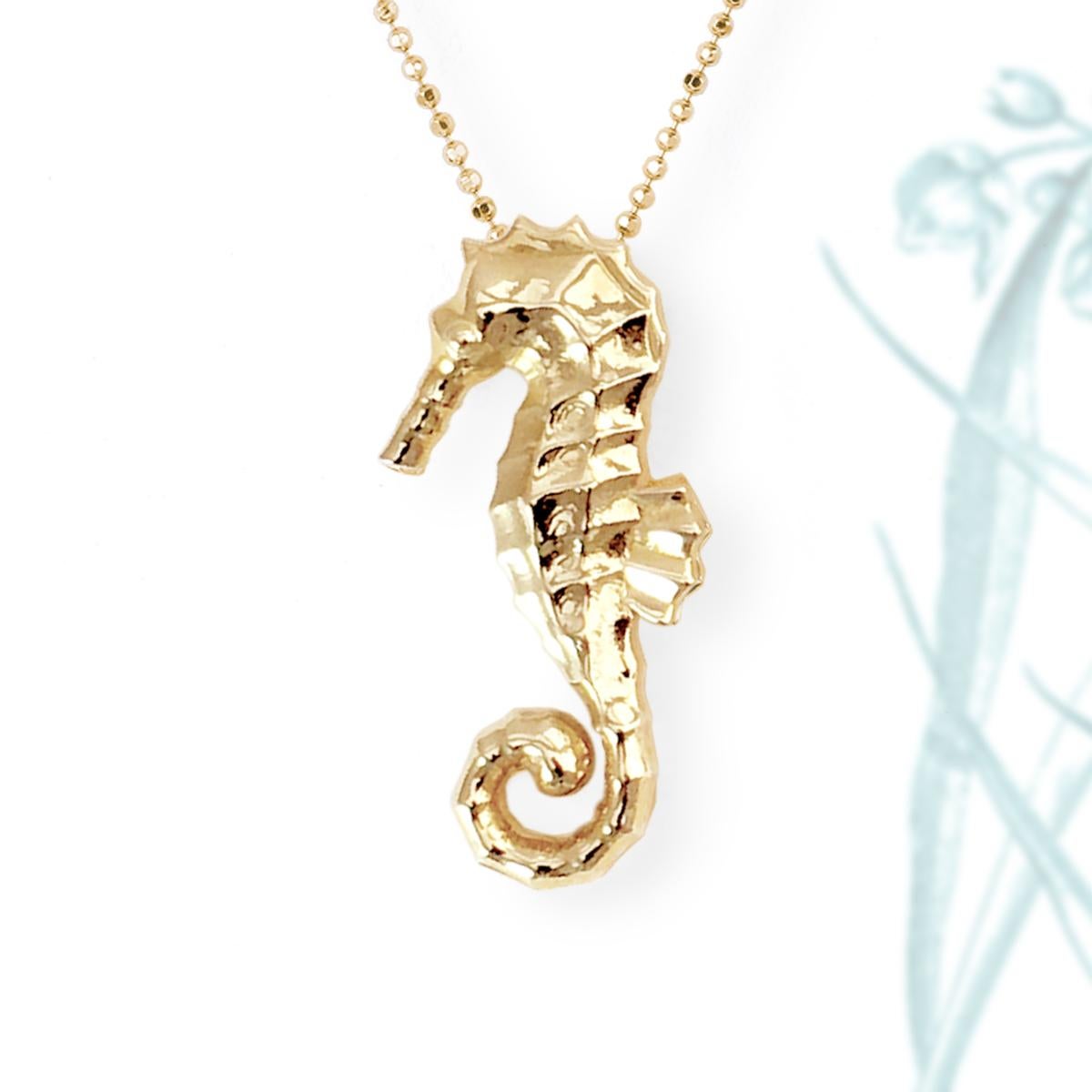 Indulge in the captivating beauty of the ocean with our Large Seahorse Pendant in Solid Yellow Gold. This limited edition piece, designed by J.Herwitt and handcrafted in Los Angeles, California, is a true work of art.

Crafted from 14 solid yellow