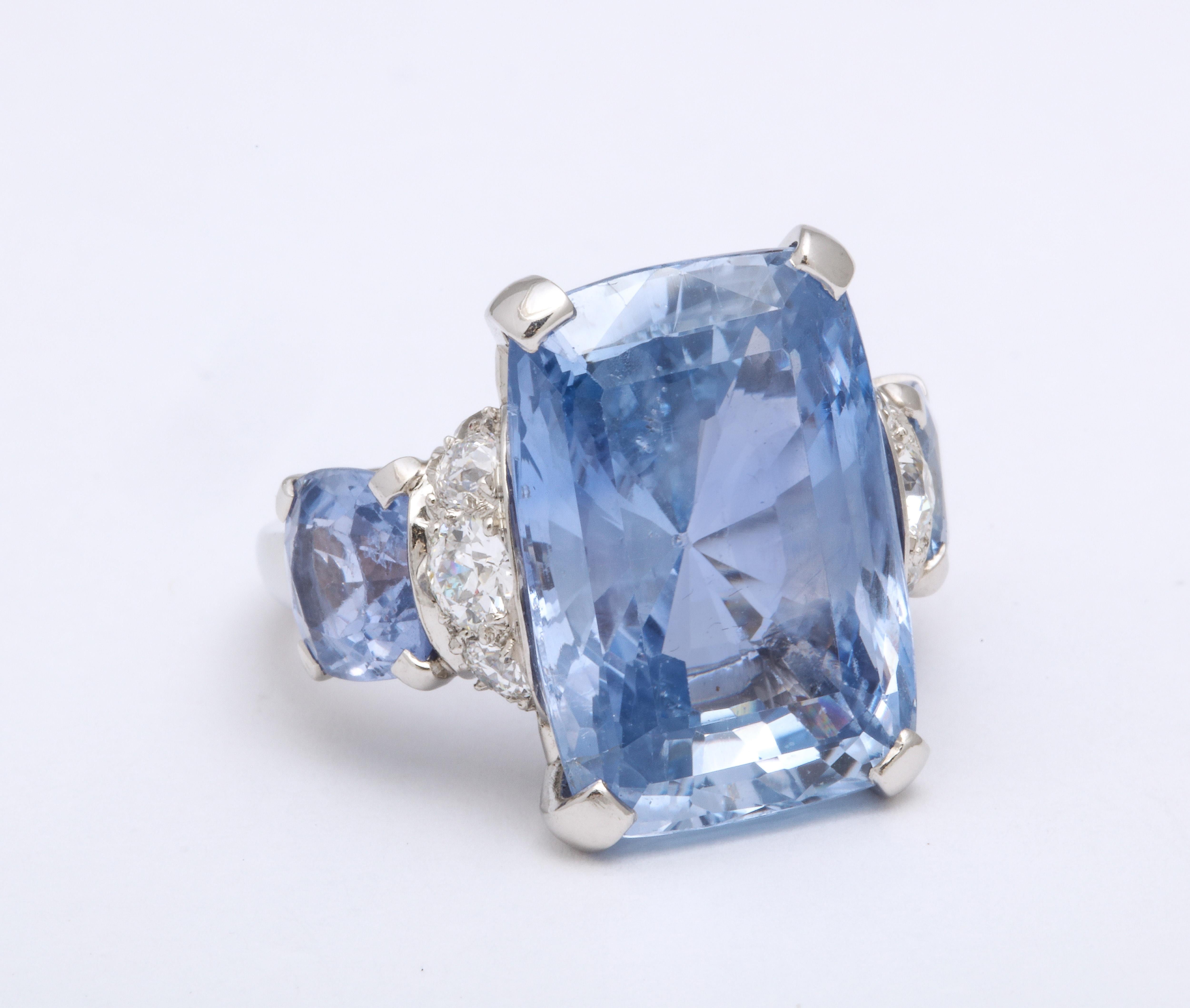 This ring is a Real Master Piece of art by Seaman Schepps.  Unbelievable approximately 30ct Ceylon Sapphire Unheated Cushion Cut Ring 

30ct center stone
6 carat total Matched pair of Ceylon Sapphire Cushion Cut Side Stones
Ring size 6 with inner