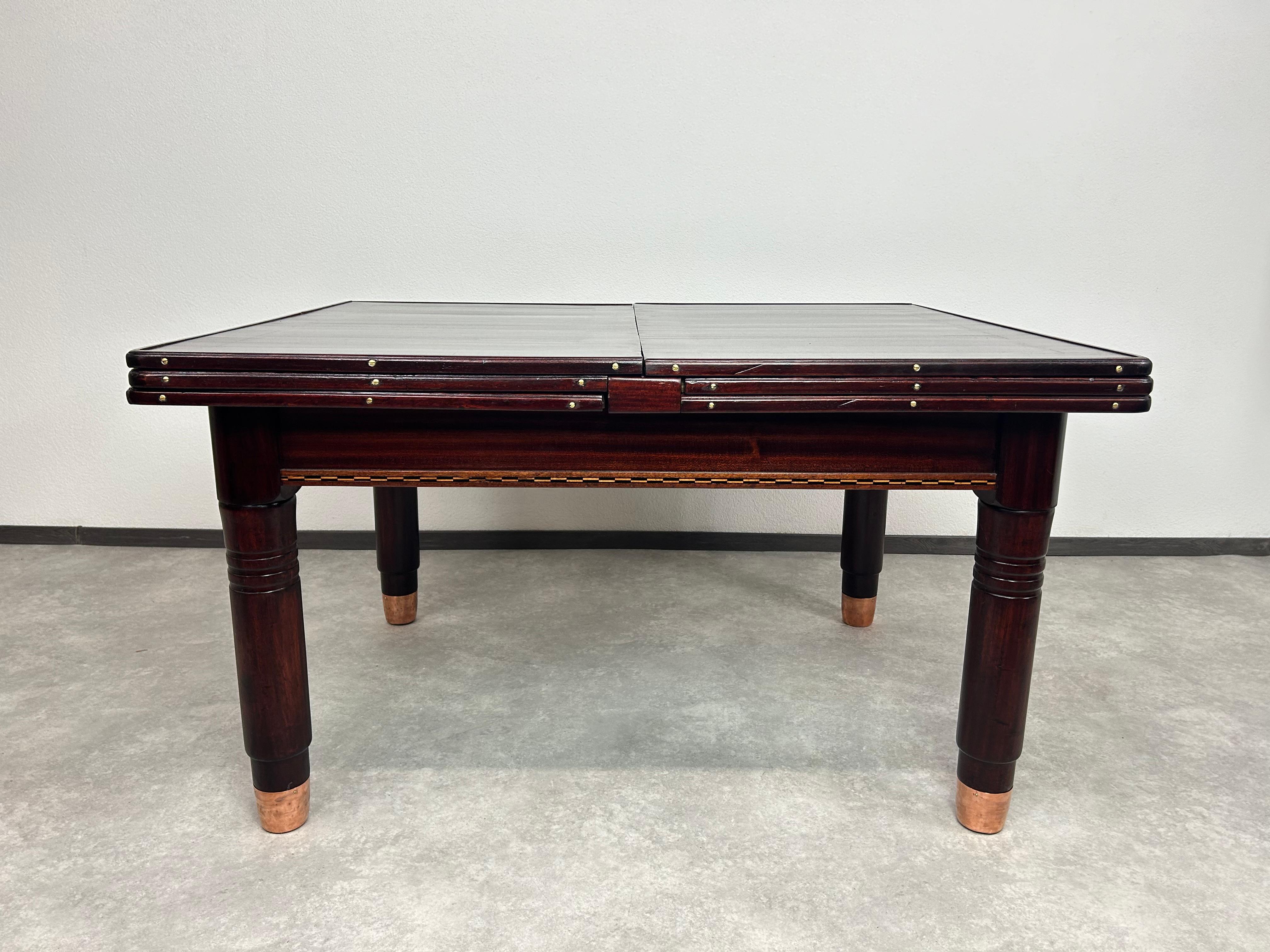 Large secession dining table by Karoly Lingel Budapest with copper leg endings for 16 people. Professionally stained and repolished. Originally, the table was designed for a tailor's workshop and was used for cutting fabrics. We replaced the old
