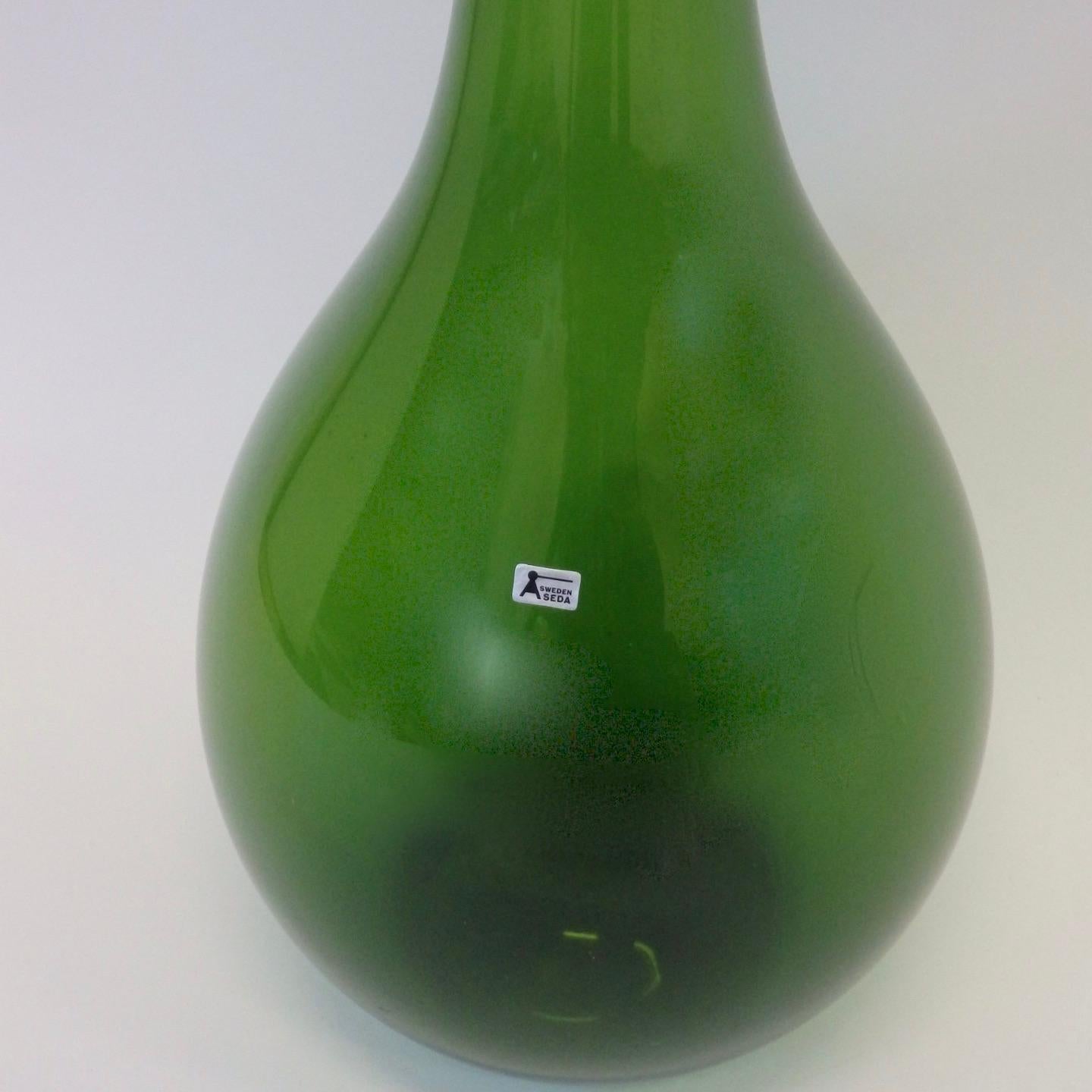 large green glass bottle vase