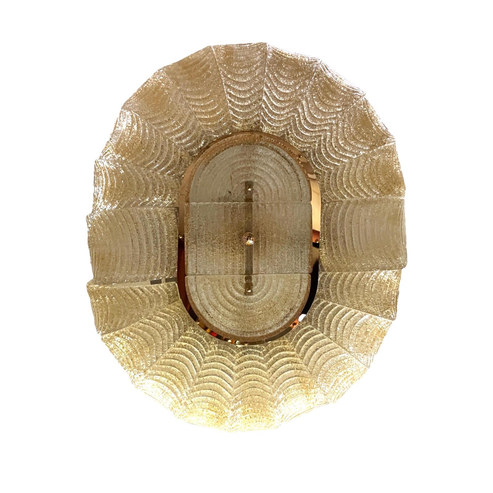 A circa 1960s gold and clear Murano glass light fixture with nine interior lights.

Measurements:
Minimum drop: 18