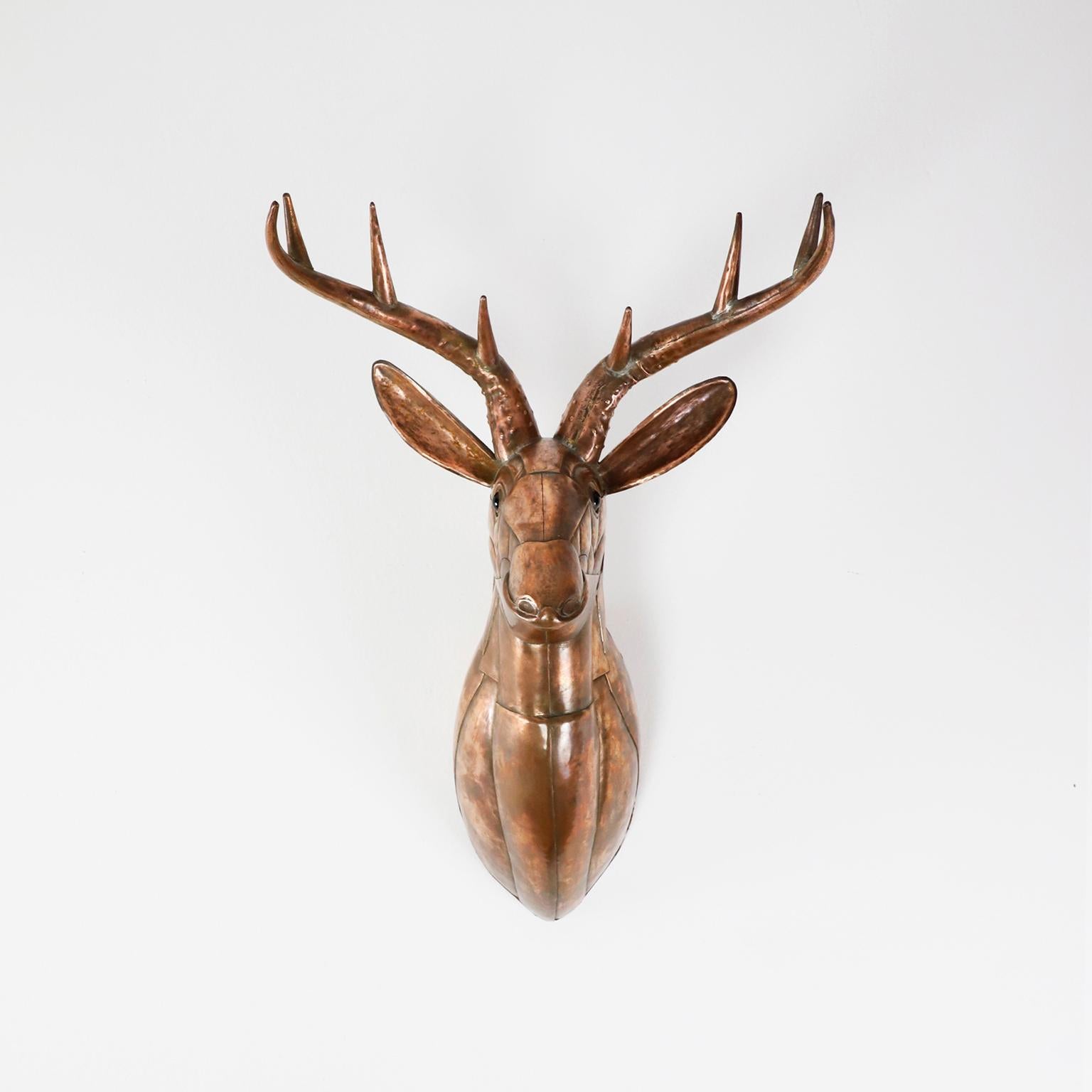 Mounted Stag head in strong copper, cut bent and assembled, circa 1960.

Sergio Bustamante is a Mexican Artist and sculptor. He began with paintings and papier mache figures, inaugurating the first exhibit of his works at the Galeria Misracha in