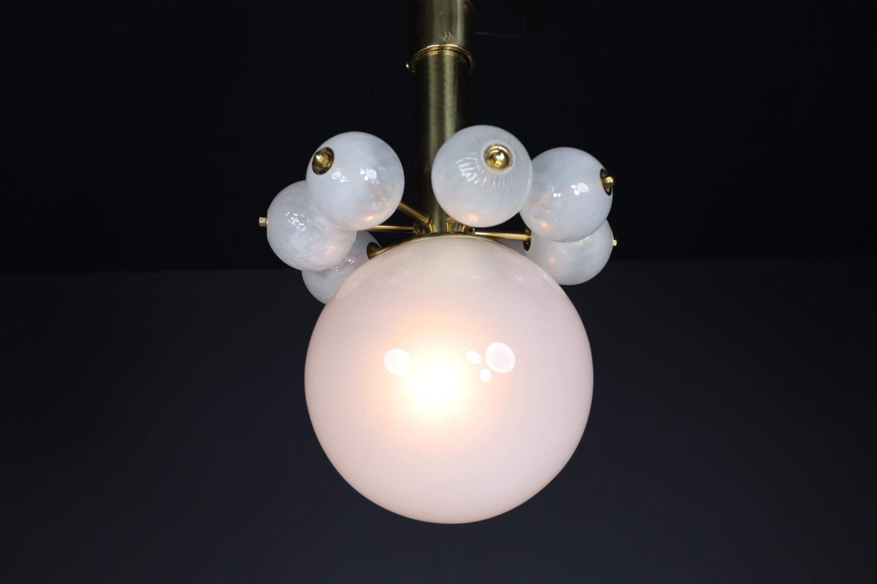 Large Set Chandeliers with Brass Fixture and Hand-Blowed Frosted Glass Globes In Good Condition For Sale In Almelo, NL