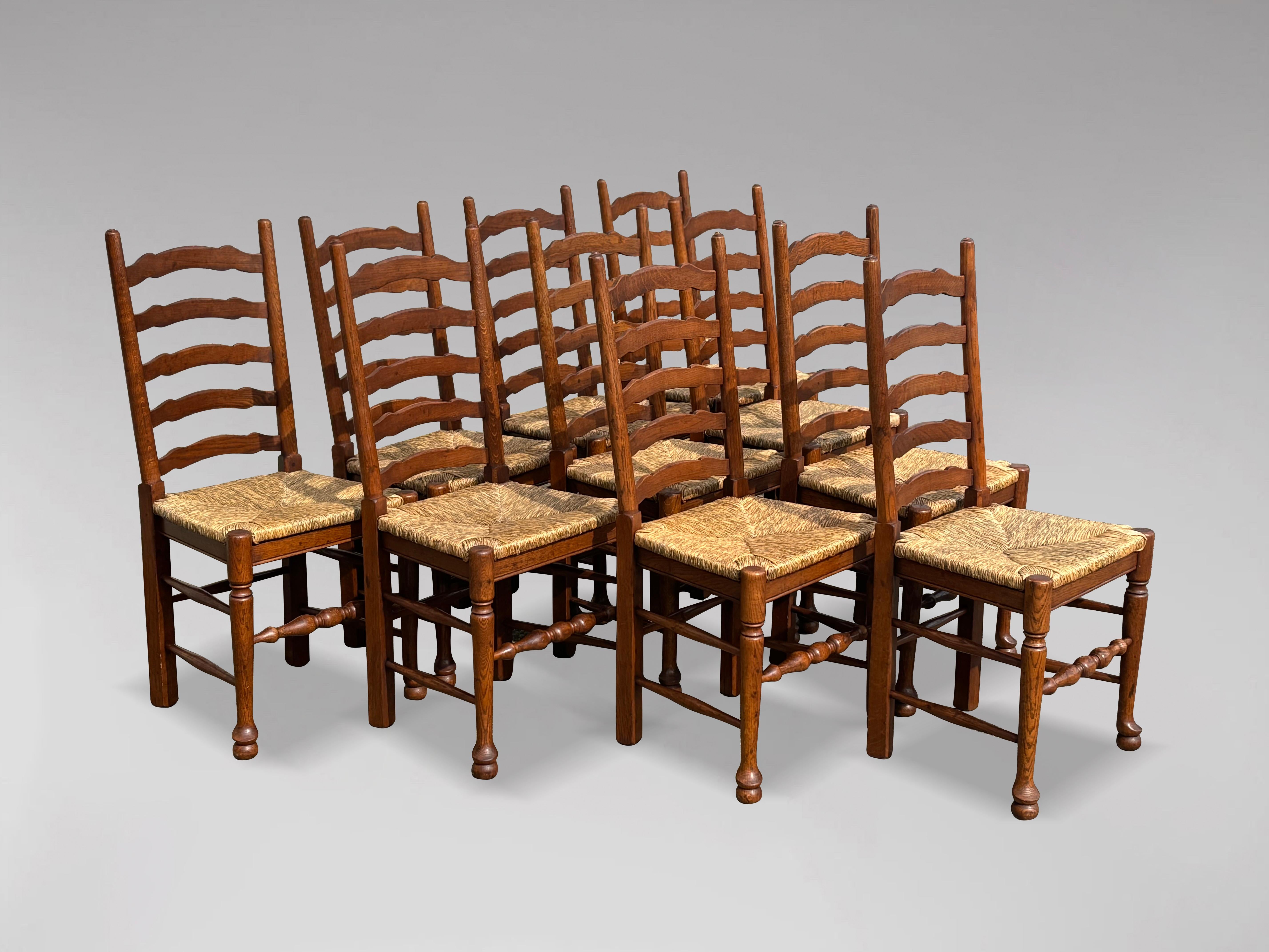British Large Set of 10 Oak Lancashire Ladder Back Country Dining Chairs For Sale