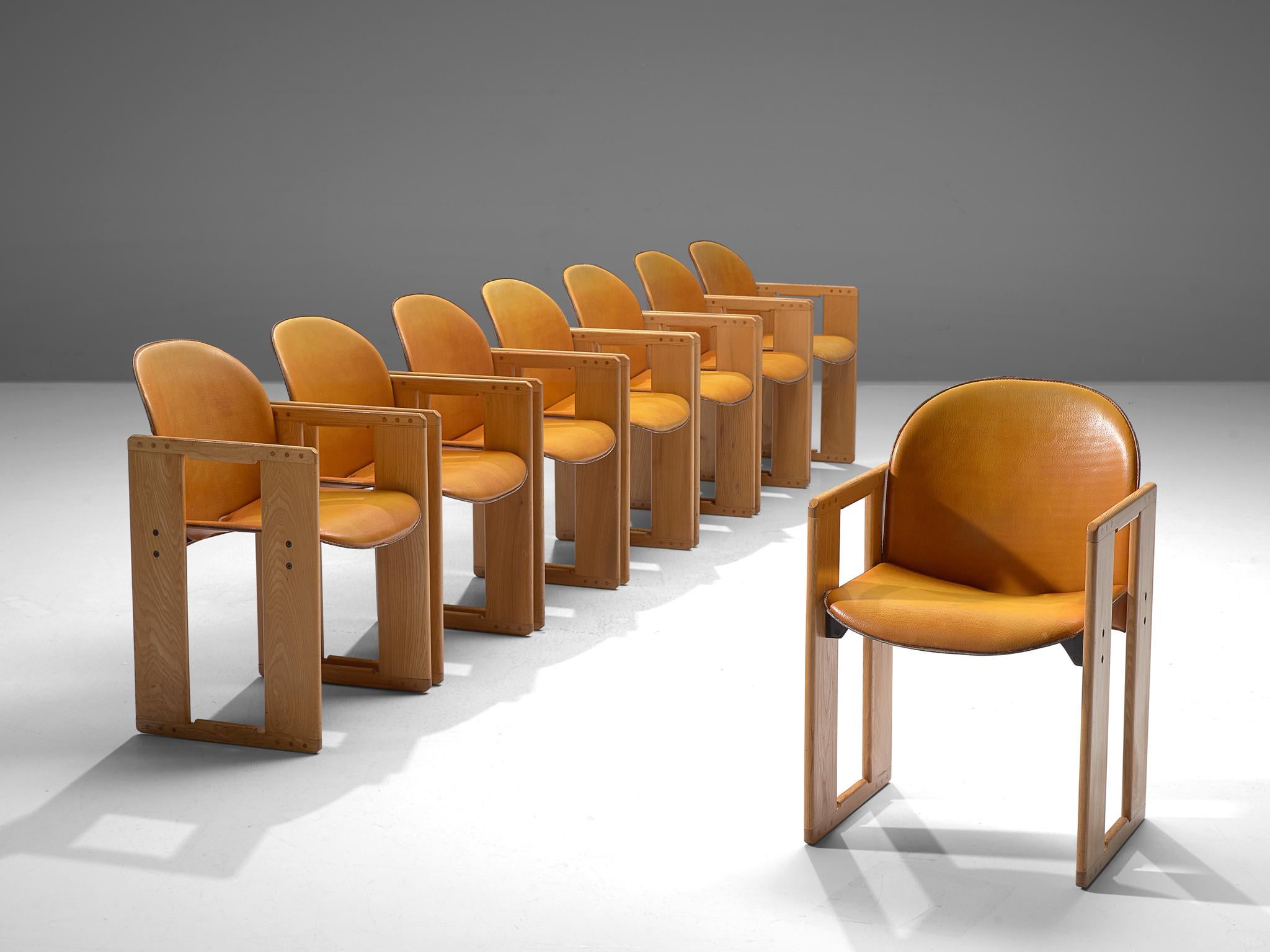 Afra and Tobia Scarpa for B&B Italia, large set of +90 dining chairs, cognac leather and wood, Italy, 1974.

This set of armchairs is both slender and firm at the same time. The leather seat and back very thin but strong thanks to the wood that is