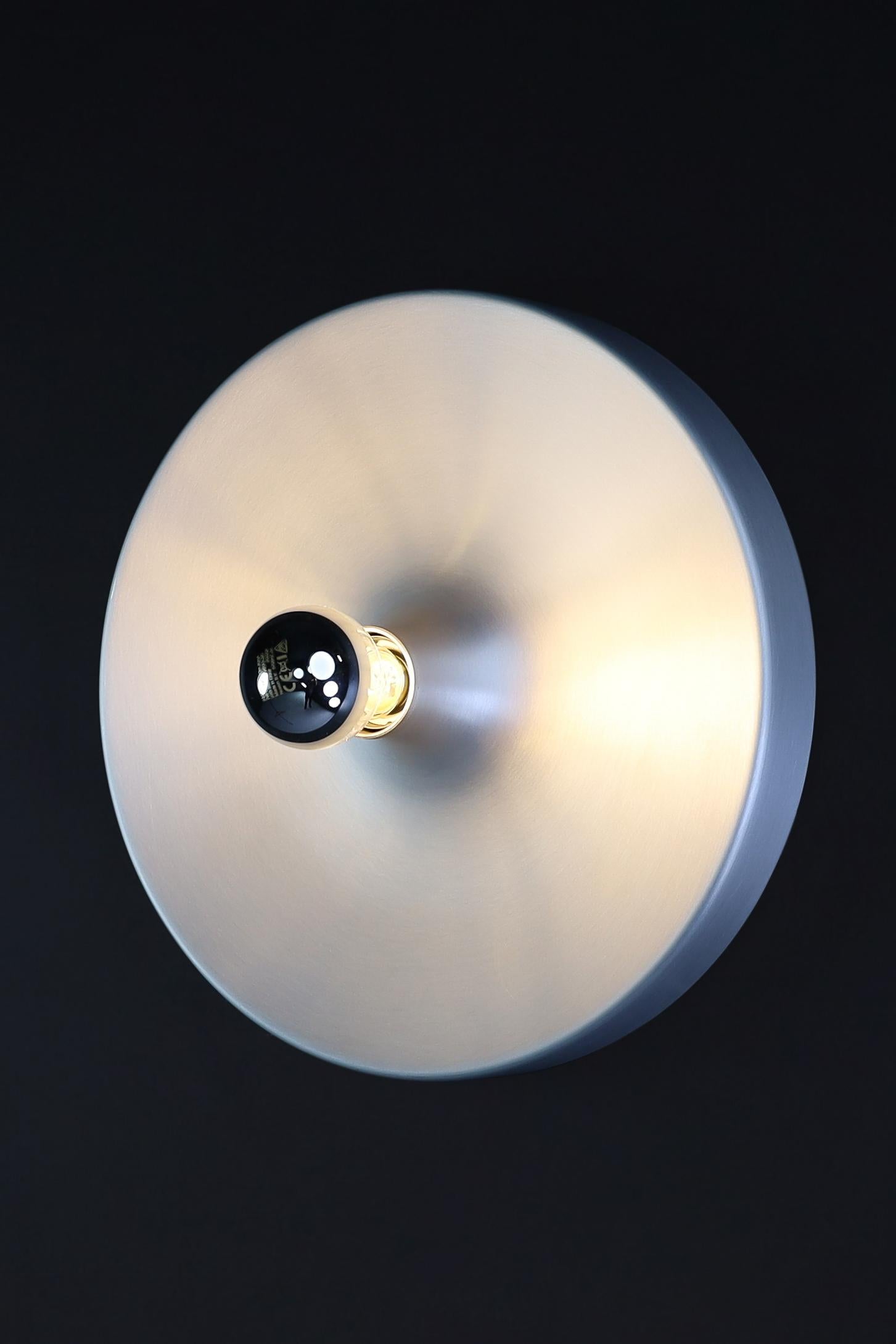 Charlotte Perriand Aluminum Disc Wall Lights set of 30, Germany 1960s

This collection of 30 Charlotte Perriand Aluminum Disc Wall Lights is quite extensive. They were commissioned and handpicked by Charlotte Perriand herself in Germany during the