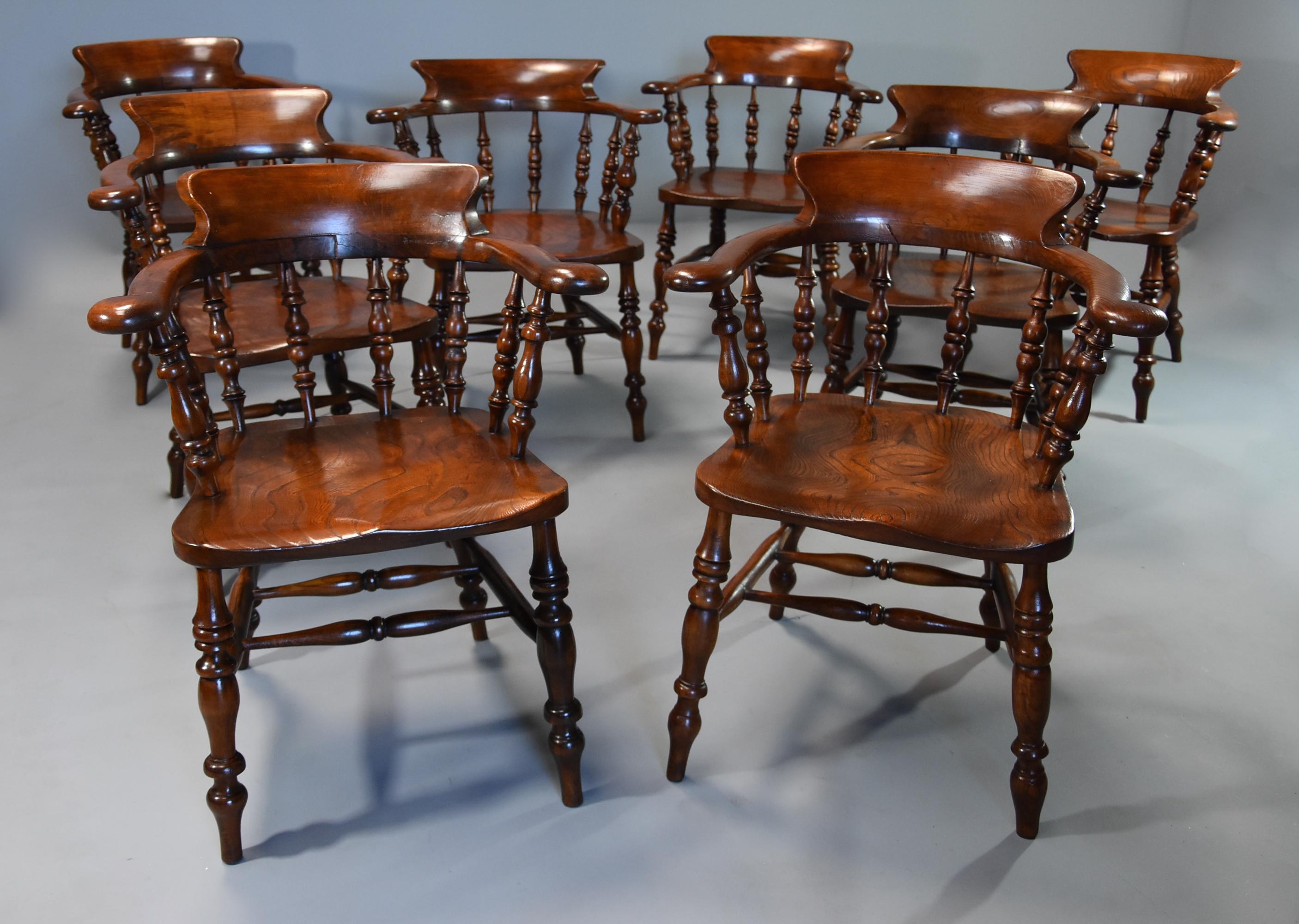 A large set of eight mid-19th century smokers bow Windsor chairs or office chairs.

This set of chairs are constructed from of a variety of woods including ash, elm and beech.

The chairs consist of a deep, shaped back support leading down to