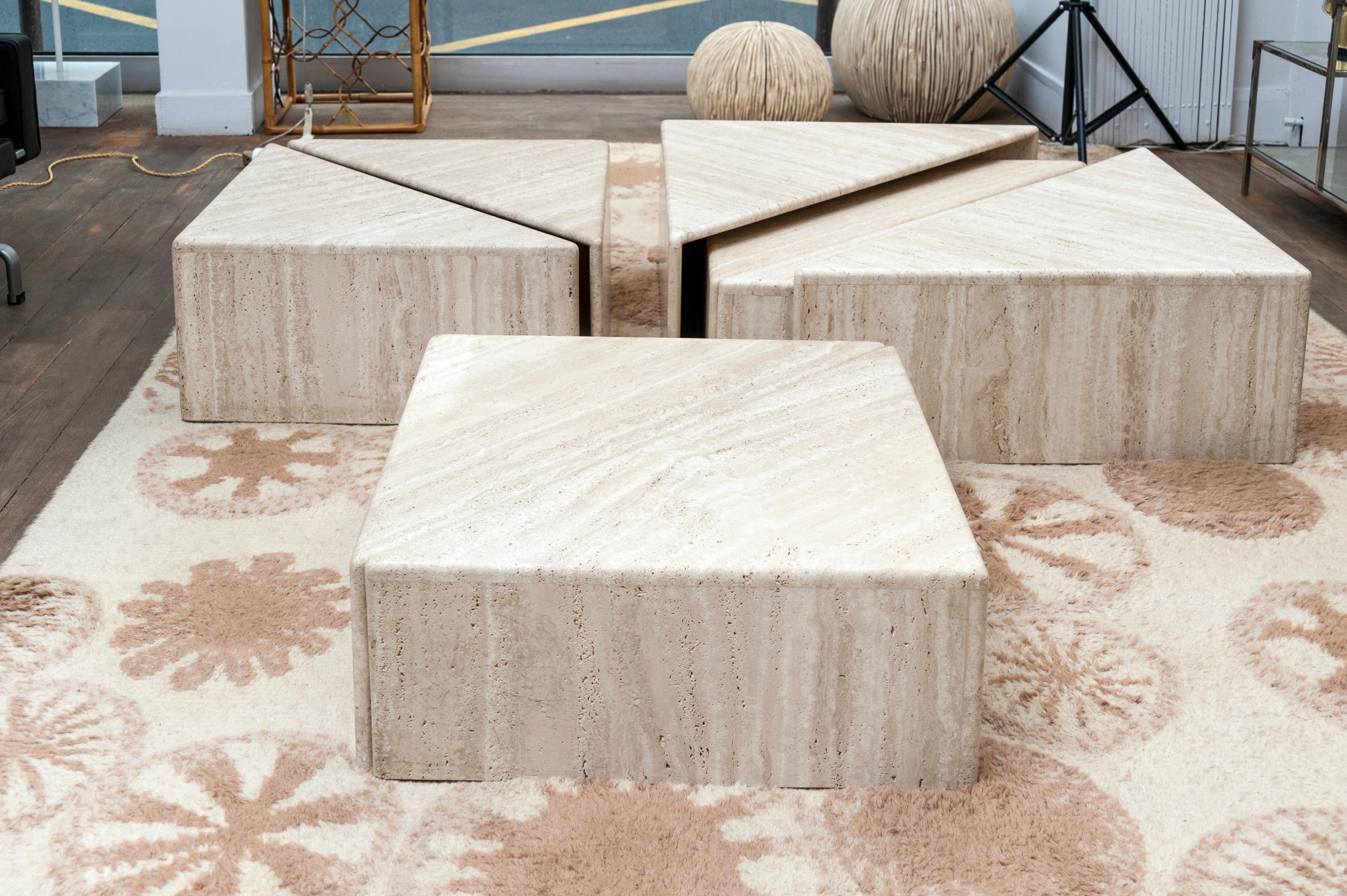A set of 8 triangular elements forming four squares.
Travertine
It's possible to combine these elements in many ways to form one or more coffee tables.
Italy, 1970s.

Measures: Square 1 : 28 x 70 x 70 cm // 11 x 27.5 x 27.5 in.
Square 2 : 23 x