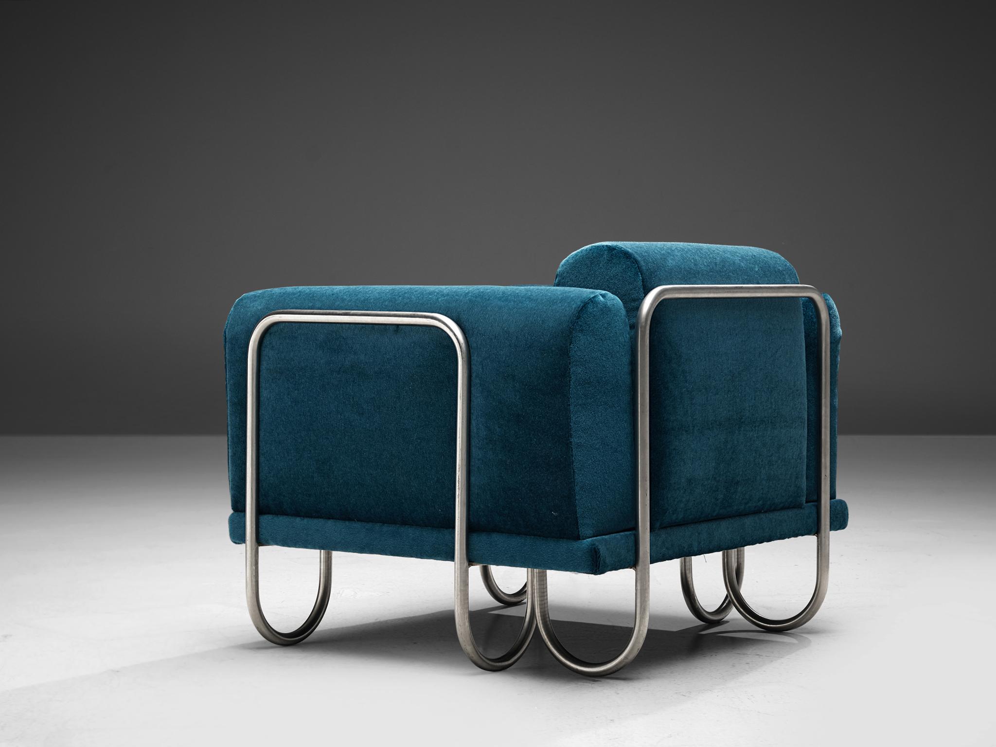 Large set of club chairs, fabric and metal, France, 1970s

A comfortable easy chair that features a curved, chromed tubular frame. The frame appears to be an ongoing curved line, moving upwards to support the cushions and downwards, functioning as