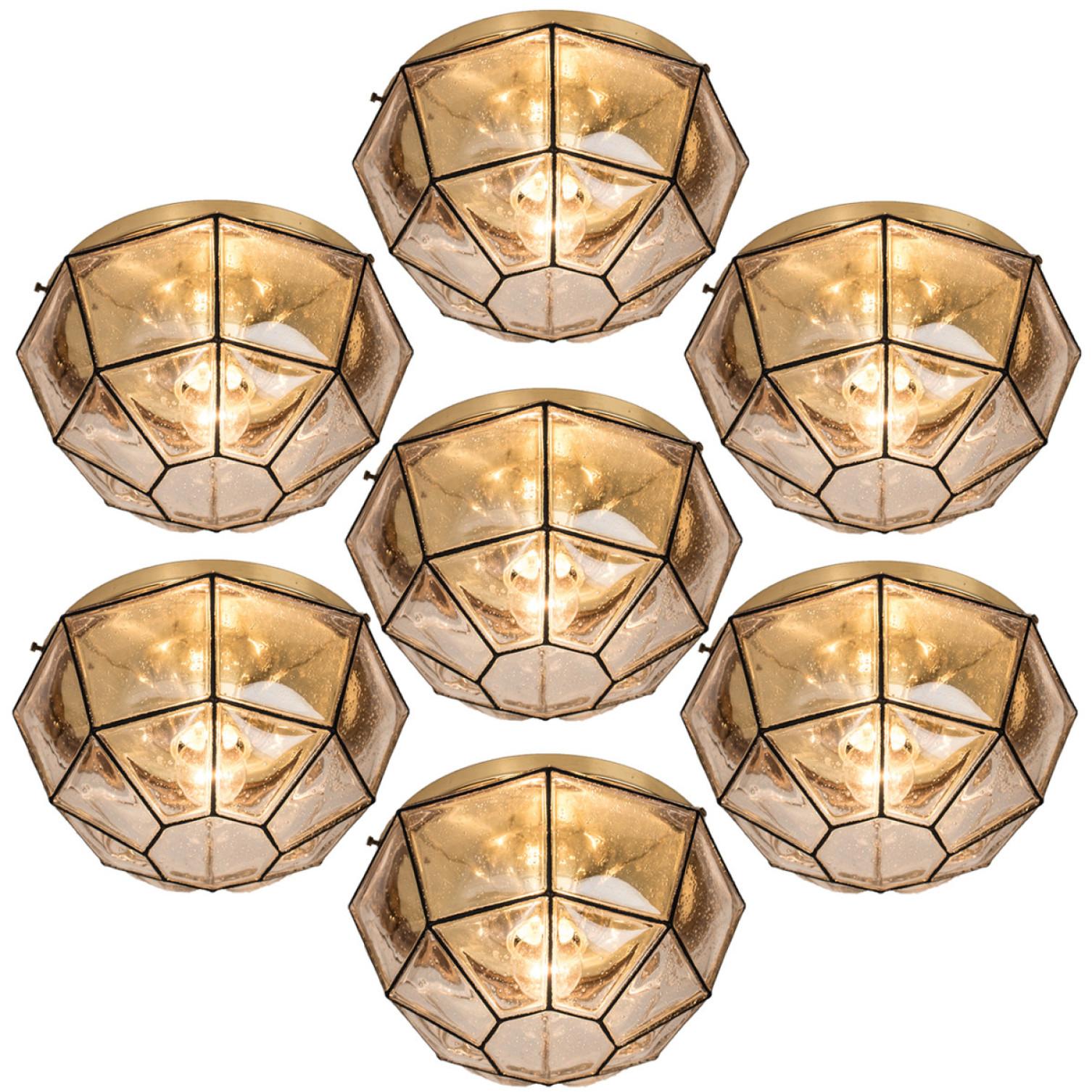 This beautiful and unique octagonal set of iron and glass light flush mounts or wall lights were manufactured by Glashütte Limburg in Germany during the 1960s (late 1960s or early 1970s). Nice craftsmanship. Elaborate clear bubble glass which bulges